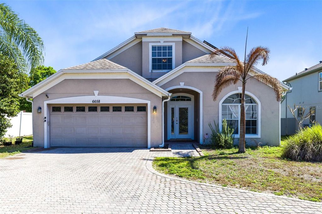Photo of 6658 Lake Pembroke Place, Orlando, FL 32829 (MLS # O6390383)