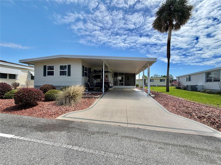Welcome to 325 Palo Verde, a pristinely kept residence where comfort, craftsmanship, and quiet sophistication come together effortlessly. A freshly painted driveway sets the tone for what awaits inside, a light-filled interior enhanced by elegant new laminate flooring (2021) that flow gracefully from room to room. Every detail has been thoughtfully curated to create an atmosphere that feels both refined and warmly livable. At the center of the home, the beautifully designed kitchen invites connection, whether you’re hosting intimate gatherings or enjoying a quiet evening in. Generous walk-in closets provide exceptional storage, while upgraded windows (2010) bathe the home in soft, natural light and elevate overall efficiency. Step into the serene, screened porch (2023), a perfect retreat for year-round relaxation, or unwind beneath the 12x15 covered patio, an inviting outdoor haven ideal for lingering mornings and peaceful evenings. This home has been carefully stewarded, with key updates already in place for ease and confidence: Aluminum Roof (2011), HVAC system (2017), Hot water heater (2017), Guest bath updated with a tub, beautifully updated master bath featuring a walk-in shower (2021). A standout feature is the expansive two-compartment utility and workshop space, complemented by a generously sized laundry room equipped with a washer and dryer (2021), designed to make everyday living both efficient and enjoyable. Offered fully furnished, this home is truly turnkey, simply arrive and begin living. A golf cart may also be included, adding an extra layer of ease to your daily routine. 325 Palo Verde is more than a home, it’s a polished, move-in-ready retreat designed for effortless living and understated elegance..............Hawthorne at Leesburg is an active, resident owned, 55+ cooperative, waterfront, gated community, with beautifully landscaped grounds, lakes with illuminated fountains and a relaxing and comfortable gazebo. The affordable monthly maintenance fee of $397 includes water, sewer, lawn mowing, private emergency services and storage space for recreational vehicles, boats, trailers and much more! The beautiful clubhouse is complete with a full-time program coordinator, more than 100 different activities and seating for 550. It has a hospitality lounge, card rooms, craft rooms, billiard room, fitness center, library, fine arts room and many more. There is excellent fishing, outdoor geo-thermally heated pool and two enclosed therapeutic pools. Hawthorne boasts a private marina monitored by an electronic security system with over 120 boat slips and access to the Harris Chain of Lakes and beyond
