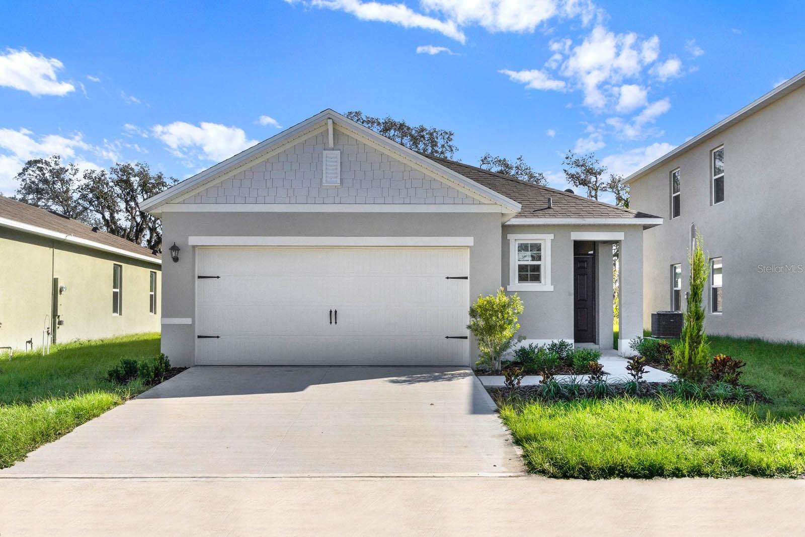 Under Construction. "The Allex is one of our one-story floorplans featured in our Cascade in Davenport, Florida. With 2 exteriors to choose from, the Allex is sure to turn heads.
Inside this 3-bedroom, 2-bathroom home, you’ll find 1,504 square feet of comfortable living. The living area is an open concept, where your kitchen, living, and dining areas blend seamlessly into a space perfect for everyday living and entertaining. Relax on the covered lanai looking out to your backyard.
The kitchen features granite countertops, stainless-steel appliances and a walk-in pantry which are sure to both turn heads and make meal prep easy. You’ll never be too far from the action with the living and dining area right there.
In every bedroom you’ll have carpeted floors and a closet in each room. Whether these rooms become bedrooms, office spaces, or other bonus rooms, there is sure to be comfort.
The primary bedroom located in the rear of the home has its own attached bathroom that features a walk-in closet and all the space you need to get ready in the morning. Sharing a sink isn’t a worry with the double vanity.
Like all homes in Cascade, the Allex includes all concrete block and also smart home technology, which allows you to control your home anytime with your smart device while near or away.
Contact us today and find your home.
*Photos are of similar model but not that of the exact house. Pictures, photographs, colors, features, and sizes are for illustration purposes only and will vary from the homes as built. Home and community information including pricing, included features, terms, availability, and amenities are subject to change and prior sale at any time without notice or obligation. Please note that no representations or warranties are made regarding school districts or school assignments; you should conduct your own investigation regarding current and future schools and school boundaries. *