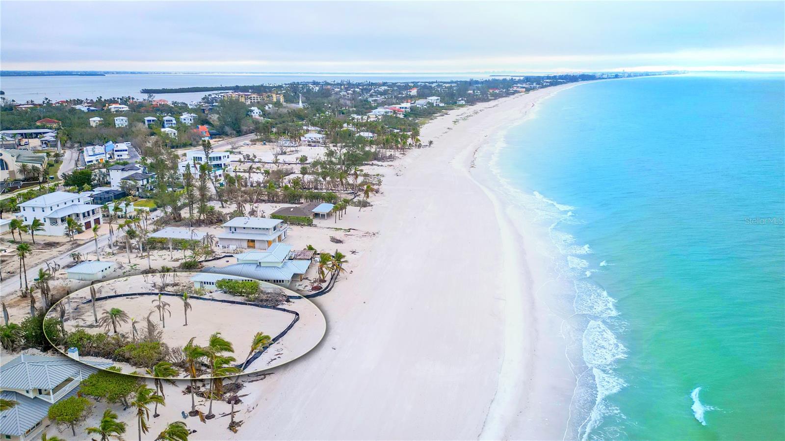 An ideal opportunity to own a direct Gulf-front estate-sized lot on the coveted shores of Longboat Key. Spanning nearly 3/4 of an acre, this expansive parcel offers the perfect canvas to create a custom coastal retreat. Cleared and primed for development, the property boasts breathtaking panoramic views of the Gulf of Mexico, with pristine white sands just steps from your future doorstep. With an unparalleled 100-feet of private beachfront, this lot presents an extraordinary opportunity to design a luxurious sanctuary. The generous dimensions of this homesite allow for endless architectural possibilities—whether envisioning a modern masterpiece or a timeless coastal estate, this setting provides the ideal backdrop. Beyond the secluded beauty of this beachfront location, the property is positioned within moments of world-class dining, shopping, and recreation. The brand-new St. Regis Longboat Key Resort, offering an array of five-star amenities, is just down the road, while the renowned Longboat Key Club is nearby for championship golf, tennis, and marina access. A short drive south brings you to the vibrant cultural hub of St. Armands Circle and downtown Sarasota, where fine dining, boutique shopping, and renowned performing arts await. To the north, the charming island ambiance of Anna Maria Island provides a laid-back escape with waterfront dining and quaint coastal charm. A truly exceptional offering, this property presents a rare chance to craft an exclusive Gulf-front residence in an unparalleled location.