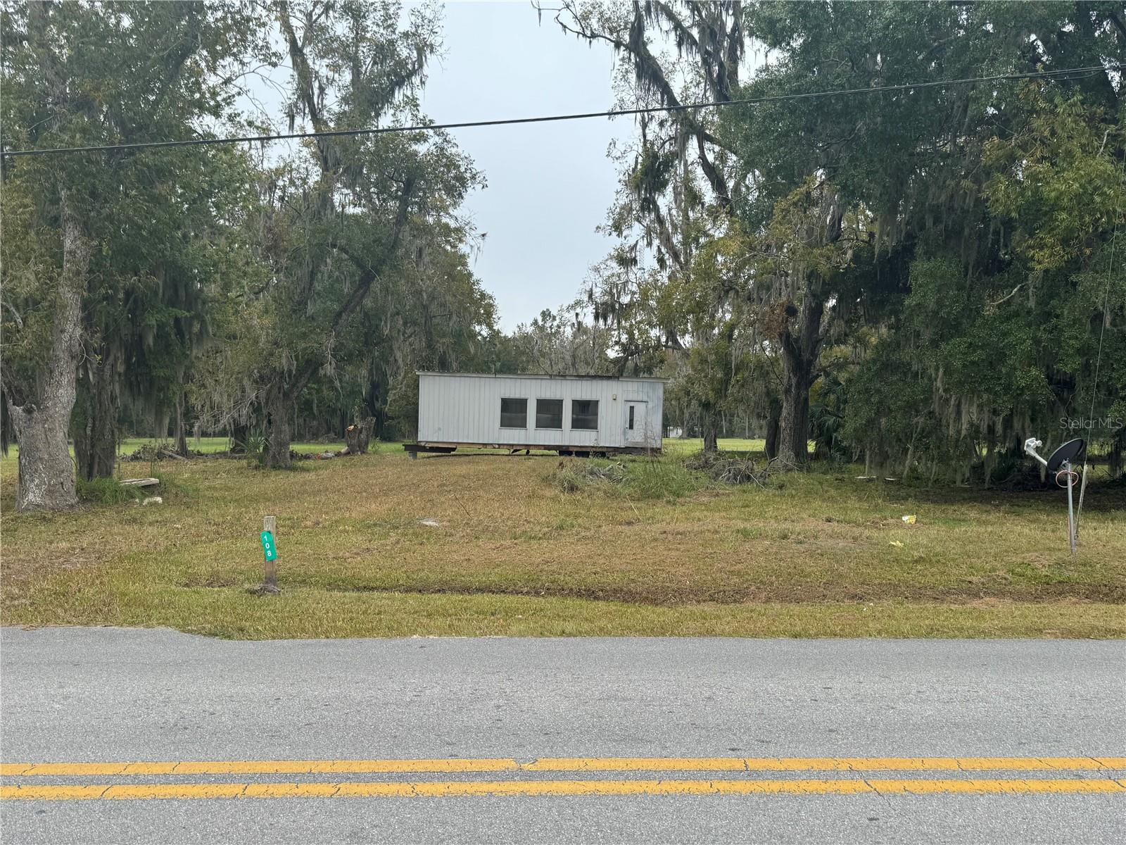 Prime 100’ x 115’ lot in the heart of Starke—ideal for investors or business owners. Includes a 12’ x 36’ modular building that can be converted into an office or other commercial use. Interior updates are needed, giving buyers the chance to finish it to their needs. On-site utilities include city water, electric, and septic. The lot provides 100’ of frontage and 115’ of depth, faces north, and sits within city limits for easy access to local amenities and downtown attractions. This visible location is directly across from the Bradford County Fairgrounds and near: Call Street Historic District – shops and restaurants Florida Twin Theatre – historic Art Deco cinema Starke Downtown Music Pavilion – festivals and events Eugene L. Mathews Historical Museum – exhibits in the courthouse Buyer must verify allowable business operations with the City of Starke. A strong mix of location, visibility, and development potential in historic downtown Bradford County. Owner Financing Available.