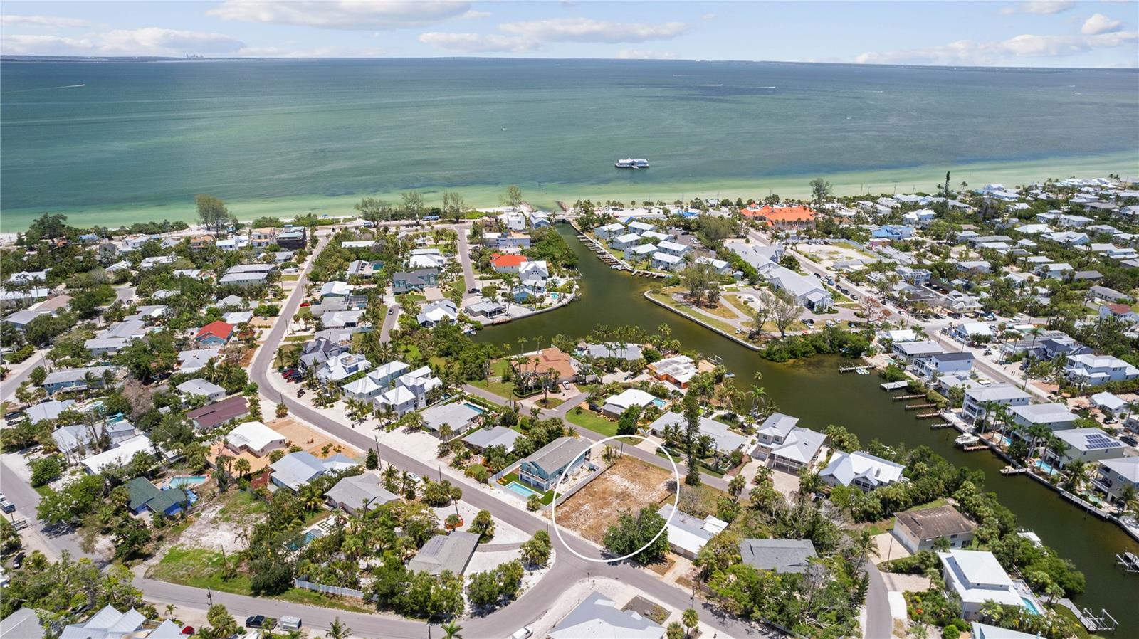 Spectacular North End Lot cleared and ready for your new home! Enjoy the Island Life in a central location! Only a block away from Pine Ave shops and Trolley Stop. Take in the beauty of Bean Point and the sugar sand beaches.This premier lot gives access to all Anna Maria Island has to offer-fine dining,shopping,water sports, along with the best sunsets in the world! Optional HOA provides common dock area for fishing & kayak with direct access channel leading into Tampa Bay.70 Ft width (7700 sq ft total) gives opportunity for wide footprint and spacious plan.Upper floors would feature canal & Tampa Bay views.Your dreams await this blank canvas where Anna Maria Island tranquility meets convenience.