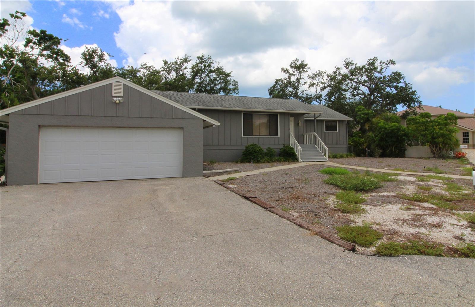 LOT LISTING FOR MLS #A4657180 This three bedroom, two bath, two car garage home with a swimming pool sits high and dry in the most elevated neighborhood on Siesta Key. This house is built on a concrete block 5ft stem wall and did NOT flood in 2024. Behind the lot line there is a natural retention swale to control potential water. Minutes to beautiful Siesta Key beach, and the Village. Invest in this land purchase with a house on this HUGE 18,000 sq feet lot that can be enjoyed or rented. Easy to see call today.