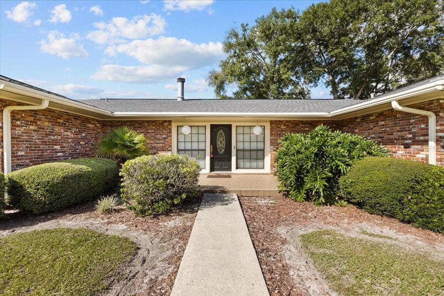 Located in the heart of Chiefland Florida you will find this Concrete Block , Antique Brick home (some bricks actually used from torn down chimneys generations ago) massive 4 bedrooms, 2.5 bathrooms , 2 car garage , huge screened porch on 5 gorgeous acres that is freshly fenced and cross fenced WITH a massive barn, cow pins , storage buildings and a feed room. If having a farm, cutting hay, planting a garden and more is a dream you've been having, then look no further .This home has been loved for many generations and it is now time to share the craftsmanship and love to a new family. Located just a few miles to town this home offers privacy and seclusion yet convenience to our local Golf and County Club, Manatee Springs State Park and The Great Suwannee River. As you enter the private paved driveway you are welcomed to the custom 2 car garage as well as detached carport, as you enter the home you will see a bright open floor plan with a gorgeous view of the pasture out back on patio. In the living room there is a gorgeous wood burning fireplace with real stone accents. A dinette sitting area, a nice open kitchen loaded with real wood custom cabinetry with a gorgeous stone wall, immaculate appliances some of which are kitchen aide. A large formal dining room with nostalgic wall paper perfect for entertaining or family holiday gatherings, with a half bathroom perfect for all guest. Down the hallway you will see the oversized master bedroom with master bathroom with walk in shower. Each guest bedroom offers ample space and guest bathroom has a combo tub /shower. You will not hear ANY outside noise as this home is SOLID with dual pane energy efficient windows and added 8 inch insulation ensuring very low energy bills. Clothing closest in the home are cedar lined hand cut by the owners grandfather many years ago. Through the sliding glass doors you can enjoy the oversized screened porch with nostalgic terrazzo flooring and the gorgeous view of the pastures out back. This property has multiple septic tanks, multiple wells (perfect for gardening or animals) , multiple power poles (with RV set up) perfect for that added family member. The massive barn is perfect for your tractor , UTV's, boat and more with a 200 amp box you can do pretty much anything in this barn. On the right side you have several stalls leading to the cow pin and on the left you have bays for storage. Also 2 additional concrete block buildings perfect for storage, workshop or keep the one room as a feed room. What was one a family homestead is now sectioned and ready for its new family to create many new memories on the farm. Enjoy the slow pace ,peace and quiet of the countryside of Chiefland Fla. Accepting ALL loans, call today for your personal tour!