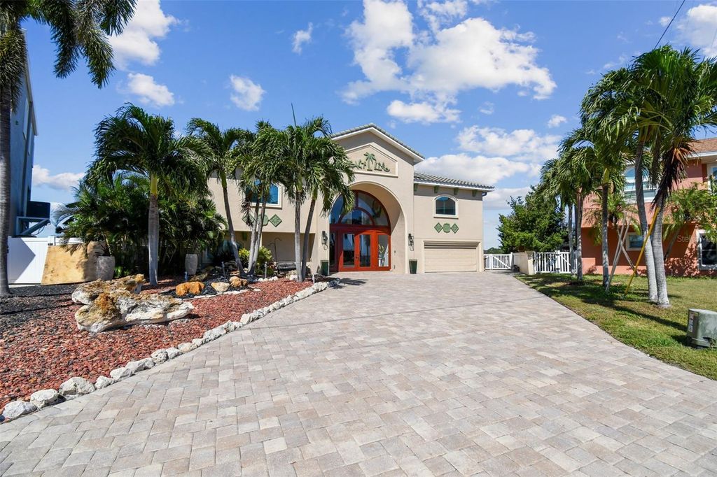 Photo of 582 Johns Pass Avenue, Madeira Beach, FL 33708 (MLS # TB8443266)