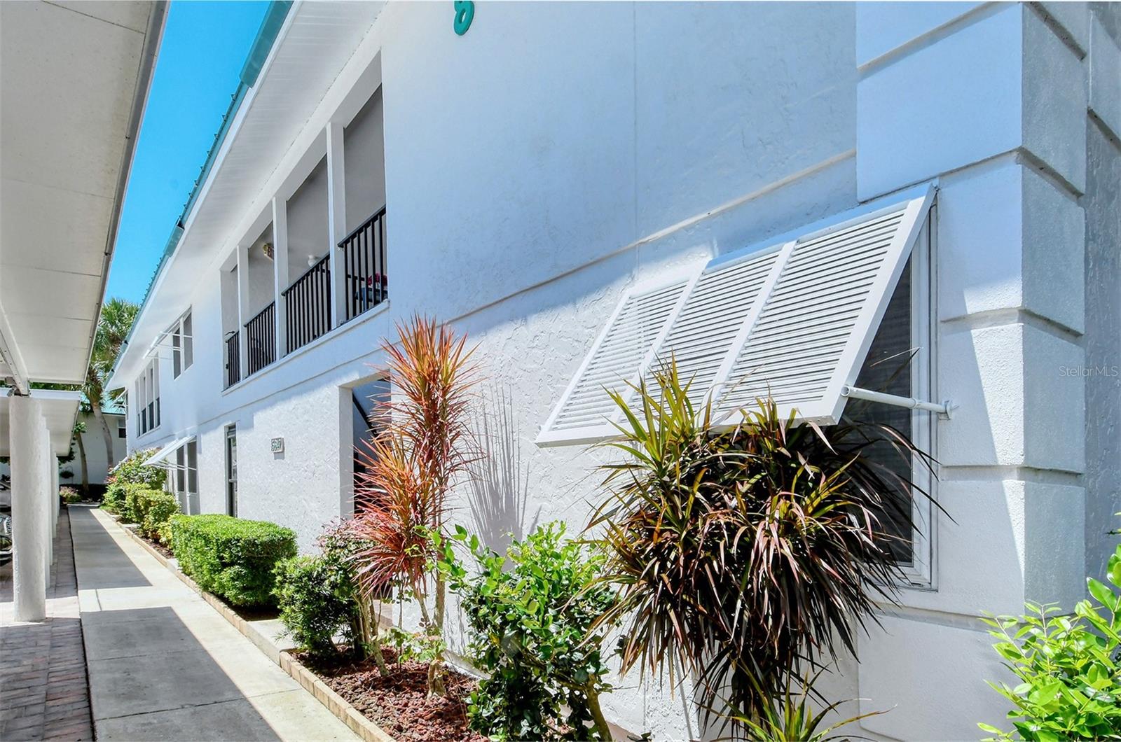 LOCATION, LOCATION, LOCATION! Nestled in the desirable beach community of Whte Sands Village, this tastefully furnished 2 bed, 2 bath condo is being sold turnkey, all you need to do is bring your toothbrush! This unit offers tile flooring throughout, crown moldings and NO popcorn ceilings! The well-equipped kitchen offers ample storage and a breakfast bar. The AC was replaced in 2021 and the Hot Water Heater in 2017 so no big-ticket items needing to be replaced. The bathrooms have been updated with cabinetry and tile and you will certainly not be disappointed with the spacious bedrooms. Relax on the balcony and enjoy the wildlife and picturesque view or take a stroll to the community pool and join in the social lifestyle this community is renowned for. The beach access is on your doorstep and of course you have the wonderful Siesta Key Village for entertainment and restaurants. Saunter to the village or take the free Siesta Key Trolley which connects the two sides of the Key. The community offers a heated pool, a clubhouse with a full kitchen, a library, BBQ, picnic areas and boat docks which are on a first come first served basis. Whether you are looking for a vacation home or an investment property the bi-weekly rentals makes this property a great opportunity!