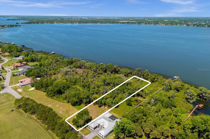 Elevate your lifestyle in the exclusive Deer Island community by building your dream home on this stunning lakefront lot! With approximately 110 feet of direct frontage on picturesque Lake Dora, you'll have the ultimate waterfront retreat at your fingertips. Imagine crafting your own private boat dock and setting off for downtown Mount Dora in just five minutes by boat, or cruising to Tavares, the vibrant hub known for its waterfront dining. From your tranquil oasis on the island, you'll have unrestricted access to the best of both worlds - serene natural beauty and lively city amenities. Whether you're indulging in leisurely lakeside strolls or immersing yourself in the vibrant culture of Mount Dora and Tavares, every day promises new adventures and unforgettable experiences.
With partial clearing already in the front of the lot  and no time limit to build, the possibilities are limitless. And with a survey, soil test, and the current owner's home design available to spark your creativity, you're one step closer to bringing your vision to life.
Deer Island is a 400-acre natural island surrounded by the waters of Lake Dora and Lake Beauclair, both part of the Harris Chain of Lakes. It features an awe-inspiring, privately-owned 18-hole championship golf course, which was recently names one of America’s Top 50 Public Golf Courses, and also ranks as #5 in the Top 25 Florida Courses! Homeowners are NOT required to be members of the golf course, but three types of memberships are available to residents and the public if desired. From this property, historic downtown Mount Dora is known for its charming restaurants, quaint shops and year round festivals. Additionally, Tavares, “America’s Sea Plane City,” is approximately ten minutes away by boat. The Deer Island community is nestled in central Lake County yet only approximately 45 minutes from Orlando attractions and shopping, as well as approximately 90 minutes to Atlantic and Gulf coast beaches!
