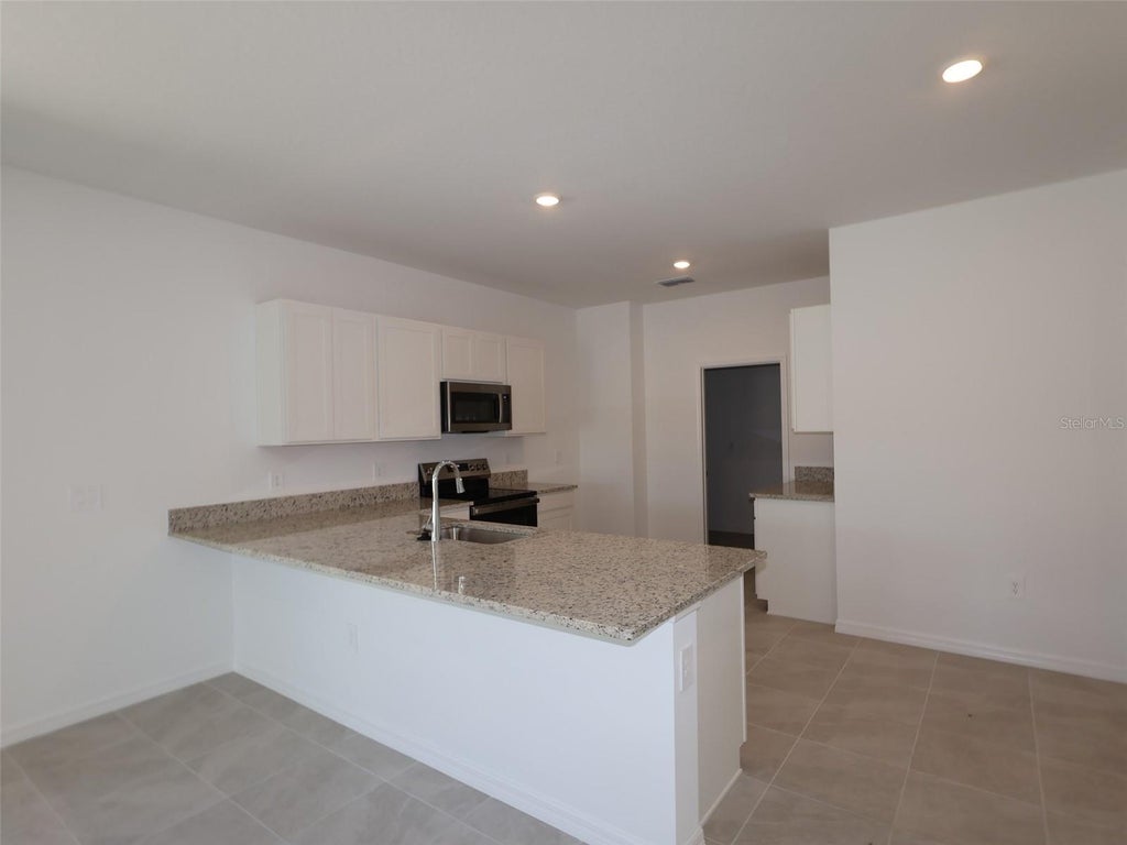 Photo of 9121 Optimist Way, Palmetto, FL 34221 (MLS # R4910702)