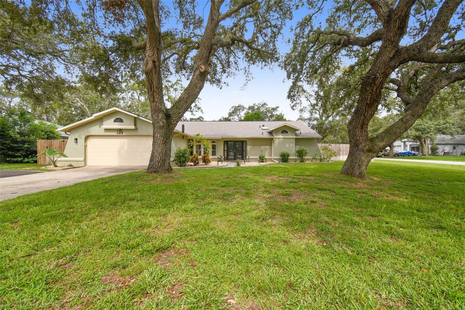 Under contract-accepting backup offers. Welcome home to this very meticulously maintained and tastefully updated 3 bed/2 bath/2 car garage, 2049 sq.ft, ''Alexander built Boca Grande Deluxe Pool Home'' with all block construction this home is situated on an oversized 11,762 sq.ft corner lot and located in a highly desirable ''Spring Hill'' subdivision. Beautiful double door entry with split and open floor plan with cathedral ceilings in great room, dining room and slider doors leading from family/great room to glistening 400 sq.ft. pool with a huge lanai space for entertaining. Eat in Kitchen has new granite countertops, new raised-panel kitchen cabinets and all new stainless-steel appliances. Upgraded plank laminate wood floors throughout, New Roof in 2020, HVAC replaced in 2015. All new double Payne windows and Sliding Glass Doors, New Impact Resistant Skylights, New insulated garage door and opener. Beautifully landscaped and very private backyard with New shed (8 X 12) and New privacy fence. Swimming pool was completely resurfaced including all new tiles! New pool heater and converted pool to salt water with a salt chlorine generator! New front Double storm door and side entry doors in garage! Many more upgrades and this one will not last long so hurry! Call, view and make offer today!