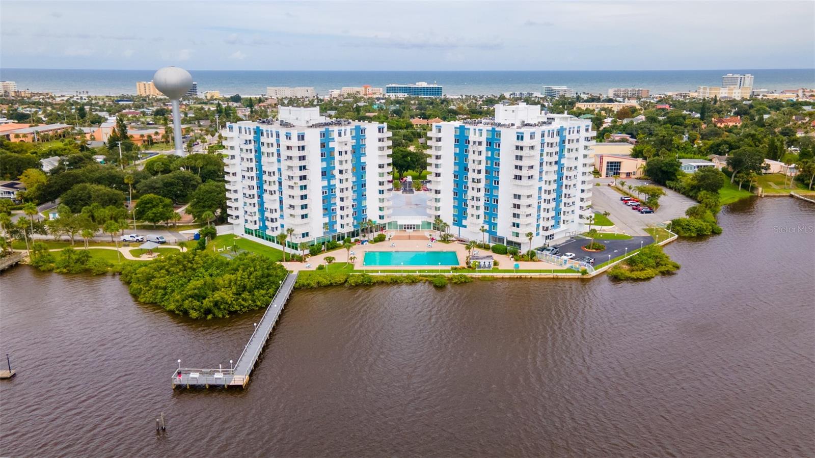What a meticulously well cared for and renovated 1 bedroom , 2 bath condo at the Bayshore Bath & Tennis Club. No carpet . Has slate tile throughout. There is also a good size bonus/flex room , making it a 2 bedroom convertible, featuring a full size murphy bed and 2 recliners.. This unit has the sq footage of a two bedroom. Sitting out on your balcony and relaxing you can see the sunrise at the beach and the sunsets over the river. Enjoy the heated pool, or go fishing off the dock, tennis courts, exercise room , steam and sauna, billiards, game room, library ,and club room. Laundry is on each floor. Walk to the beach just blocks away. There is so much to do here. Plenty of nearby restaurants , shopping, hospital and the airport. The oven is an air-fryer and convection . Furniture and furnishings can be conveyed with purchase of condo. Don't wait , come and view and fall in love with this unit. You could be enjoying this place as your own for the upcoming Holiday's!