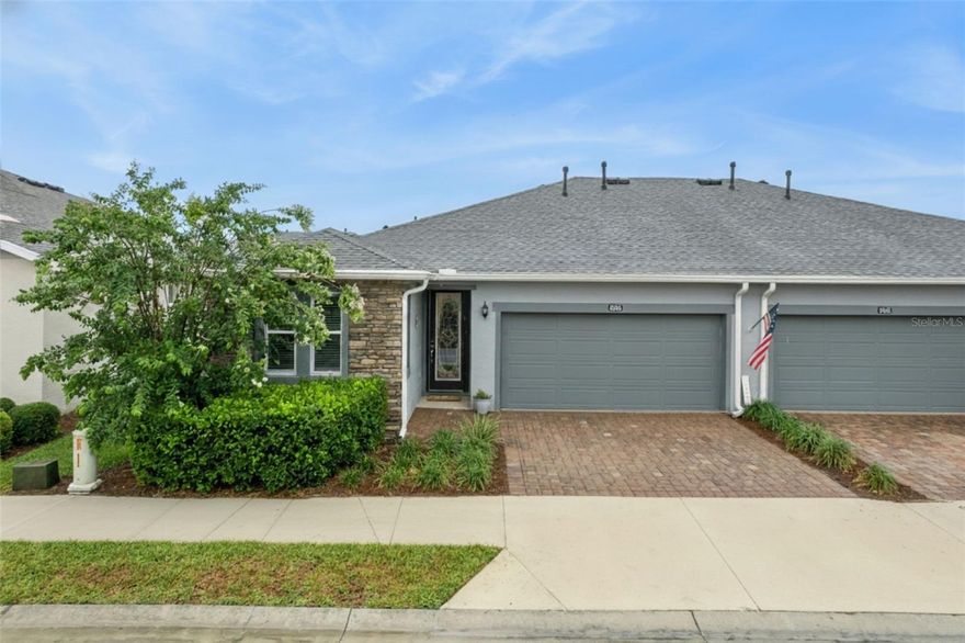 Meticulously maintained Aria Villa located in the highly desirable 55+ community of Ocala Preserve, set among groves of majestic live oaks with scenic green spaces. Living in Ocala Preserve grants exclusive access to a world of amenities, including championship 18-hole golf course, 20+ miles of Walking/Bike Trails, Tennis, Racquetball and Pickleball Courts, Resort Style Pools, On-Site Restaurant, State-of-the-art Athletic Center, Bocce, Horseshoe, Fishing Dock, Clubhouse, Day Spa, Dog Park and more! So go ahead, take in a round of golf, indulge in a game on the court, or simply stroll along the serene walking trails. Grab a kayak and head out to watch the sunrise over the lake. Learn new kitchen skills with a culinary class. Gather with your friends and enjoy a Chef inspired meal at Salt and Brick. Refresh and renew with an afternoon of pampering at the Spa. This is the lifestyle you have been waiting for! This is the Villa you must see! A move-in-ready, maintenance-free villa offering the perfect blend of comfort, convenience, and resort-style living. Thoughtfully enhanced beyond the builder’s base model and ready for you to enjoy immediately. This 2-bed, 2-bath villa features an open-concept split floor plan, a flex room with laundry ideal for a home office or hobby space, and a 2-car garage. Step inside to tall ceilings, natural light, and a layout that flows effortlessly into an expansive open-concept great room. The spacious kitchen boosts upgraded granite counters, soft-close cabinets, custom backsplash, large single-bowl sink and gas range. Tucked privately off the back of the home, the primary suite features large walk-in closet and stunning ensuite bath complete with custom tiled step-in shower, dual vanities and water closet. A private secondary bedroom and bath provide a spacious guest retreat. Step outside to the covered lanai with extended paver patio and privacy wall - ideal for morning coffee or evening gatherings. Equipped with SMART Home technology, this home allows you to manage lighting, climate, and security whether you are home or away – ensuring your home is as connected as it is beautiful. The home also offers added whole house water filtration and all-natural gas for cooking, heating, hot water and dryer. Add’l high-end touches include 8' interior doors, upgraded plank-style flooring throughout, elegant glass front door, and epoxy coated garage floors. For ultimate peace of mind, the HOA reserve fund provides exterior maintenance, including roof replacement, power washing, lawn and landscaping as well as irrigation, ensuring your luxurious haven remains impeccable. Outside the community gates, downtown Ocala is just 6.5 miles away, so you're an easy drive from shopping, dining, and a vibrant arts and culture scene. And 4.5 miles from the World Equestrian Center and 11 miles from HITS Ocala - ideal for those looking to enjoy Ocala horse country, equestrian season and events. Close to grocery stores, banks, and medical facilities, with easy access to major roadways, airports and cruise ports. While most homes come with a list of things to fix and update, this home comes truly turn-key, requiring no work. It’s the home you have been waiting for - just step in! Schedule your showing today!