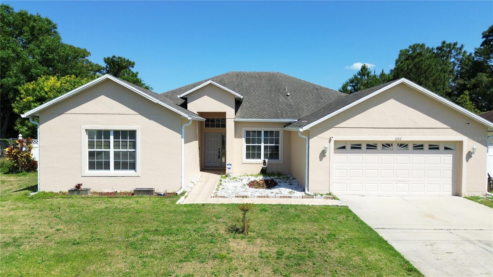 Welcome to 686 Cotulla Drive, a beautifully renovated 4-bedroom, 3-bathroom home located in the thriving city of Kissimmee, FL. This stunning property has been fully renovated with modern upgrades and offers the perfect blend of style, comfort, and functionality. Step inside to discover an inviting living space adorned with brand new porcelain tiles flooring throughout, creating a sleek and contemporary ambiance. The kitchen has been upgraded with new appliances, providing the perfect setting for culinary adventures. The spacious master bedroom features an ensuite bathroom, offering a private retreat for relaxation. Three additional bedrooms provide ample space for family and guests, while the remaining bathrooms have been tastefully renovated with modern fixtures and finishes. Outside, you'll find a detached shed, perfect for storing tools, equipment, or outdoor essentials. The highlight of this property is the heated swimming pool, where you can enjoy leisurely swims or host gatherings with friends and family. Relax and unwind in the large screen enclosed lanai, offering a serene outdoor oasis for year-round enjoyment. Conveniently located in Kissimmee, FL, this home offers easy access to shopping, dining, entertainment, and major highways, making it the ideal place to call home. Don't miss your chance to own this exceptional property. Contact us today to schedule a viewing and experience modern living at its finest!