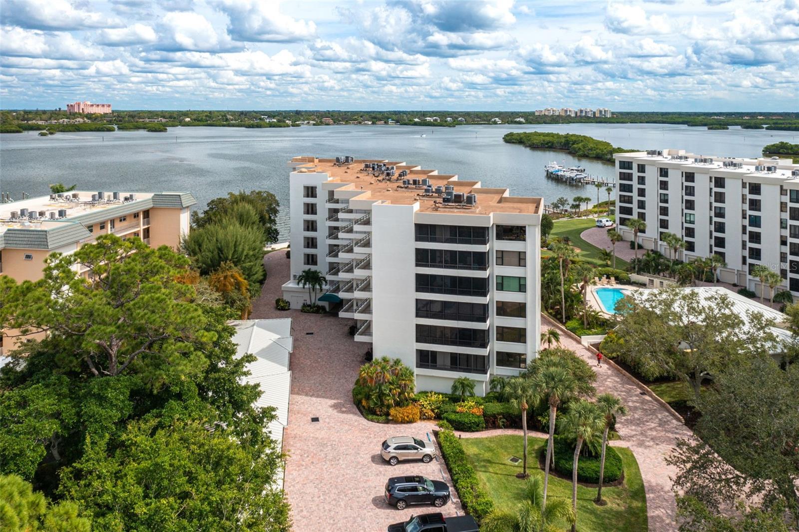 PRICE IMPROVEMENT! SELLERS WILL CONSIDER ALL OFFERS!
**THIS PROPERTY QUALIFIES FOR A 1% LENDER INCENTIVE IF USING PREFERRED LENDER. INQUIRE FOR MORE DETAILS.**
Prime Location! Prime Living! This spacious 2-bedroom, 2-bathroom condo is located in the meticulously maintained Turtle Bay Community, offering views of Little Sarasota Bay. The upgraded kitchen features sleek stainless steel appliances, elegant countertops, and a convenient breakfast bar that seamlessly flows into the open dining and living areas—ideal for both entertaining and everyday living. Step out onto the airy, enclosed, and screened lanai, where you can enjoy your morning coffee while watching the sunrise over Sarasota Bay. The primary bedroom is a true retreat, offering ample space, an updated en-suite bathroom with granite countertops, a built-in vanity, and a walk-in closet for added convenience. The second bedroom is perfect for guests or family members, offering plenty of space to make anyone feel at home. Recent updates include beautifully updated bathrooms, a 2023 Trane HVAC unit, and the community recently completed the Milestone Inspection, providing peace of mind to the new owner. This unit includes a spacious 12x22 detached end unit garage—ideal for your car, beach gear, or boating supplies. Turtle Bay is a bayside community located on the south end of world-famous Siesta Key. The lush landscaping, newly updated fishing pier, and boat dock - boat slips are available for $300/year, are just a few of the incredible amenities. Enjoy easy access to the sparkling Gulf of Mexico waters with deeded beach access just across the street via the Tortuga Community for direct access to Siesta Key’s powdery sand beaches and world-famous sunsets., where you can relax on the sand and catch some of the most breathtaking sunsets. Other amenities include a heated pool, hot tub, clubhouse, grill and picnic area, lighted tennis courts, and pickleball courts. For added convenience, the condo comes with a detached garage, and plenty of guest parking. The property is near Siesta Key Village, with restaurants, shops, and entertainment, and offers easy access to Siesta Key Beach and Village via the Siesta Key Trolley. Live the dream in this beautiful condo, which perfectly blends comfort, and convenience in one of Sarasota’s most desirable communities. Don’t miss out on this incredible opportunity —schedule your showing today!