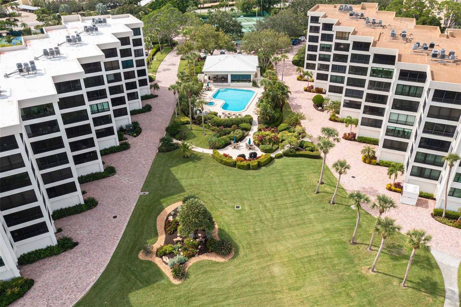 PRICE IMPROVEMENT! SELLERS WILL CONSIDER ALL OFFERS!
**THIS PROPERTY QUALIFIES FOR A 1% LENDER INCENTIVE IF USING PREFERRED LENDER. INQUIRE FOR MORE DETAILS.**
Prime Location! Prime Living! This spacious 2-bedroom, 2-bathroom condo is located in the meticulously maintained Turtle Bay Community, offering views of Little Sarasota Bay. The upgraded kitchen features sleek stainless steel appliances, elegant countertops, and a convenient breakfast bar that seamlessly flows into the open dining and living areas—ideal for both entertaining and everyday living. Step out onto the airy, enclosed, and screened lanai, where you can enjoy your morning coffee while watching the sunrise over Sarasota Bay. The primary bedroom is a true retreat, offering ample space, an updated en-suite bathroom with granite countertops, a built-in vanity, and a walk-in closet for added convenience. The second bedroom is perfect for guests or family members, offering plenty of space to make anyone feel at home. Recent updates include beautifully updated bathrooms, a 2023 Trane HVAC unit, and the community recently completed the Milestone Inspection, providing peace of mind to the new owner. This unit includes a spacious 12x22 detached end unit garage—ideal for your car, beach gear, or boating supplies. Turtle Bay is a bayside community located on the south end of world-famous Siesta Key. The lush landscaping, newly updated fishing pier, and boat dock - boat slips are available for $300/year, are just a few of the incredible amenities. Enjoy easy access to the sparkling Gulf of Mexico waters with deeded beach access just across the street via the Tortuga Community for direct access to Siesta Key’s powdery sand beaches and world-famous sunsets., where you can relax on the sand and catch some of the most breathtaking sunsets. Other amenities include a heated pool, hot tub, clubhouse, grill and picnic area, lighted tennis courts, and pickleball courts. For added convenience, the condo comes with a detached garage, and plenty of guest parking. The property is near Siesta Key Village, with restaurants, shops, and entertainment, and offers easy access to Siesta Key Beach and Village via the Siesta Key Trolley. Live the dream in this beautiful condo, which perfectly blends comfort, and convenience in one of Sarasota’s most desirable communities. Don’t miss out on this incredible opportunity —schedule your showing today!