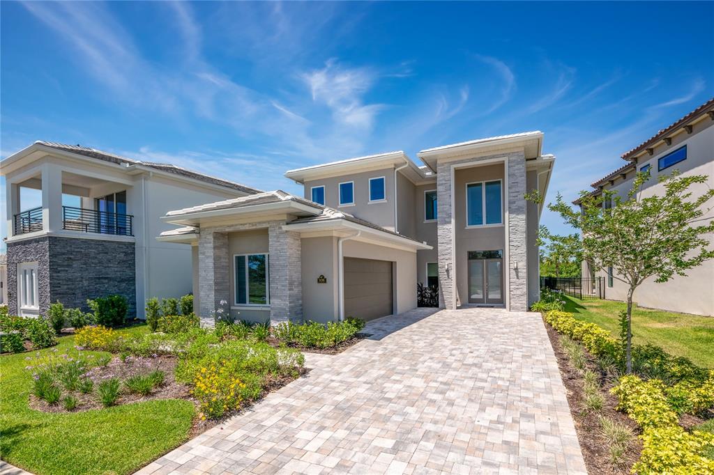 Luxurious South Facing Furnished 6 Bedroom Custom Home with a state of the art movie theatre located in the gated community of Bears Den at Reunion Resort. This home features amazing golf views overlooking the 18th green of the Jack Nicklaus course and is walking distance to the Clubhouse. Enjoy an outdoor pool and entertaining area equipped with a built in summer kitchen. A spacious master suite on each level with a large shower, separate tub, dual sinks and spacious walk in closets. There is beautiful tile flooring in all common areas on the first level, hard wood stairs and flooring in the great room upstairs. Gourmet kitchen with light tasteful finishes throughout with additional cabinets and storage off the dining room. There are stainless steel appliances throughout the kitchen along with a gas oven. Upstairs includes a great room for entertaining and you can enjoy the beautiful golf views from the covered balcony. Reunion Resort is a World Class destination just 10 minutes away from Walt Disney World with access to 3 signature golf courses, 6 tennis courts, a water park with a lazy river, as well as various restaurants within the community. The impressive clubhouse at Bears Den features a club restaurant, pro shop, men's and women's locker rooms, as well as a well-equipped exercise room. Call today to schedule a private showing. A 1.5% Jack Nicklaus royalty fee is due on total purchase price at closing. This is a Jack Nicklaus Licensed community. Reunion Membership required with home.