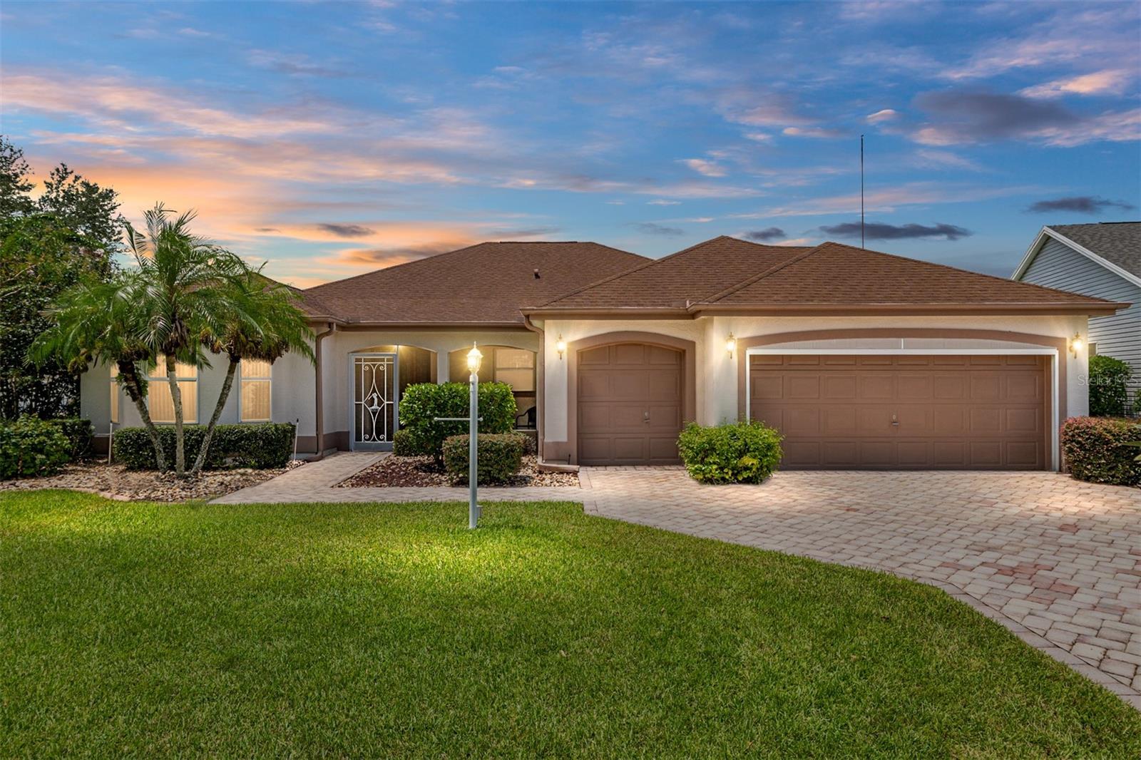 NO BOND, 2 MASTER SUITES, CORNER lot, and much more! This expanded BLOCK & STUCCO Vera Cruz Designer home features 3 bedrooms, 3 bathrooms, and a golf cart garage in the highly sought-after Village of De La Vista. As you approach this home, you'll notice the pavered driveway and walkway, along with a QUAINT FRONT PORCH—perfect for relaxing and enjoying the fantastic Florida weather! Step inside the foyer to see a coat closet and tile flooring that extends throughout the kitchen and laundry room. The spacious kitchen features beautiful wood cabinetry, neutral-toned countertops, and a nook area with a bay window that brings in natural light. High ceilings in the expansive open-concept living and dining rooms create an airy atmosphere. The primary bedroom has vaulted ceilings, two walk-in closets, and an en-suite bathroom with wood cabinetry, double sinks, a makeup vanity, and a tub/shower combo. It features a split floor plan, accompanied by an additional primary suite that boasts vaulted ceilings, two walk-in closets, and an en-suite bathroom with similar features. The third bedroom includes built-in cabinets, a desk, and a walk-in closet, while the third bathroom is conveniently located nearby, making it ideal for guests or a quiet home office. The large interior laundry room offers shelving, a window that provides natural light, and extra space for a desk, an additional refrigerator/freezer, or extra storage shelves and cabinets.
Additional features include: ROOF(2017), HVAC (2025), HWH (2025), freshly painted interior, corner lot, and solar tubes! Located in the heart of the Village of De La Vista, this home is just minutes from Lake Sumter Landing and Spanish Springs Town Square. It’s within walking distance to Tierra Del Sol Country Club, theater, recreational center, restaurant, and De La Vista and Mira Mesa Executive Golf Courses. Plus, you’re conveniently close to Highway 441/27 and County Road 466, where a variety of shopping, dining, banking, and medical facilities await. Don’t miss your chance to own this unique home in a PRIME location.