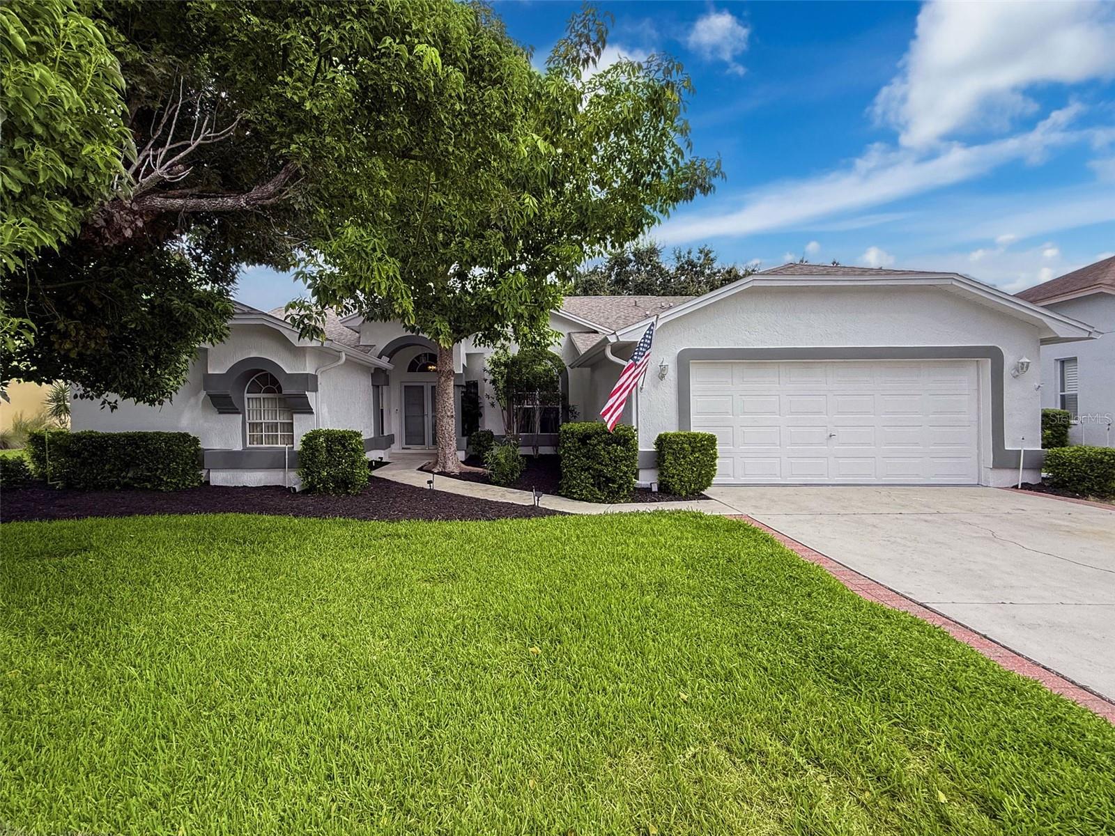 Welcome to The Estates, an established community of custom-built homes. 8311 Danbury is a meticulously maintained 3-bedroom, 2-bath pool home. As you walk in, you are wowed with the high ceilings and the luxurious wood grain tile floors throughout. The light, bright Great Room offers a wood burning fireplace. Eat-in Kitchen features wood cabinets, pantry, granite countertops, and stainless-steel appliances. The separate Freezer conveys with the home. French Doors open to the outdoor entertaining area with a covered lanai, crystal clear pool and spa for that great "indoor-outdoor" Florida lifestyle. This home was designed with a split floor plan, the spacious primary bedroom ensuite features a walk-in closet, a double vanity with dual sinks, a jetted soaking tub, walk-in shower and a private water closet. The pool table was recently refinished and will convey with the home or can be removed. The low HOA includes upgraded cable, high-speed internet, lawn care, pest control, trash pickup, and full access to the clubhouse, with a fitness center, outdoor pool, library, billiards, ping pong, tennis, pickleball, and basketball . Don't forget to bring your golf clubs to play on the many public courses in the area. You will be 2 miles off the Gulf of America so pack the kayaks and fishing rods.