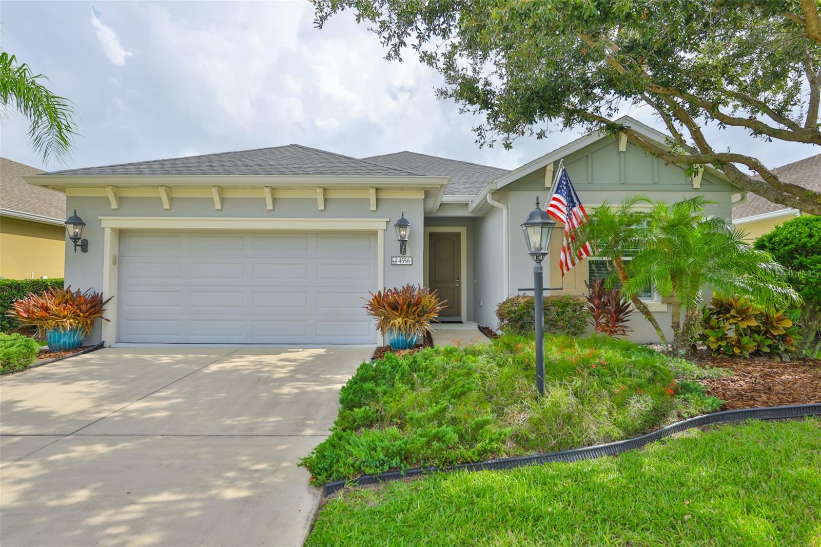 Step into elegance with this meticulously maintained 2 bedroom residence with a large den that could serve as a 3rd bedroom or guest room. When you compare this property to other listings you will be amazed at all of the upgrades that were placed in the home. The highlight of the home is a massive 13x28 extended lanai which has travertine flooring and an infinity screen...just gorgeous! Every detail has been attended to. The original owner spared no expense! The open floor plan flows effortlessly, highlighted by crown molding throughout and an abundance of natural light. The light, bright kitchen is a chef’s dream, featuring upgraded under-cabinet recessed lighting, a central island perfect for entertaining, and seamless views into the living and dining areas. The living area flows onto an extended lanai with upgraded lighting features, and unobstructed lake views. You will thoroughly enjoy the serene, lakefront, Florida living from the extended lanai which is surrounded by lush, mature landscaping for ultimate privacy. Bonus: All of the wall mounted TV's come with the home. This residence offers the perfect blend of luxury and comfort, ideal for those who appreciate thoughtful upgrades and tranquil outdoor living. Note: The total tax amount includes Forest Creek CDD.