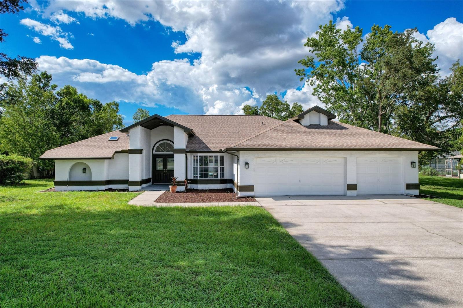 Step into this beautifully renovated 4-bedroom, 3-bathroom pool home located in one of the area’s most sought-after neighborhoods. Thoughtfully redesigned for modern living, this home boasts spacious living areas, including two oversized primary suites, perfect for multigenerational living or an in-law suite. One of the primary bedrooms is a massive 22' x 15' retreat with a full private bath. The heart of the home is the gourmet kitchen, showcasing quartz countertops, brand-new stainless steel appliances, and clear views of the sparkling pool—perfect for entertaining while cooking. Situated on half an acre, the property offers privacy, space, and comfort—inside and out. Enjoy peace of mind with a brand-new AC system and a roof replaced in 2013. The three-car garage provides ample storage and functionality.
This immaculate home is move-in ready and waiting for its new owner!