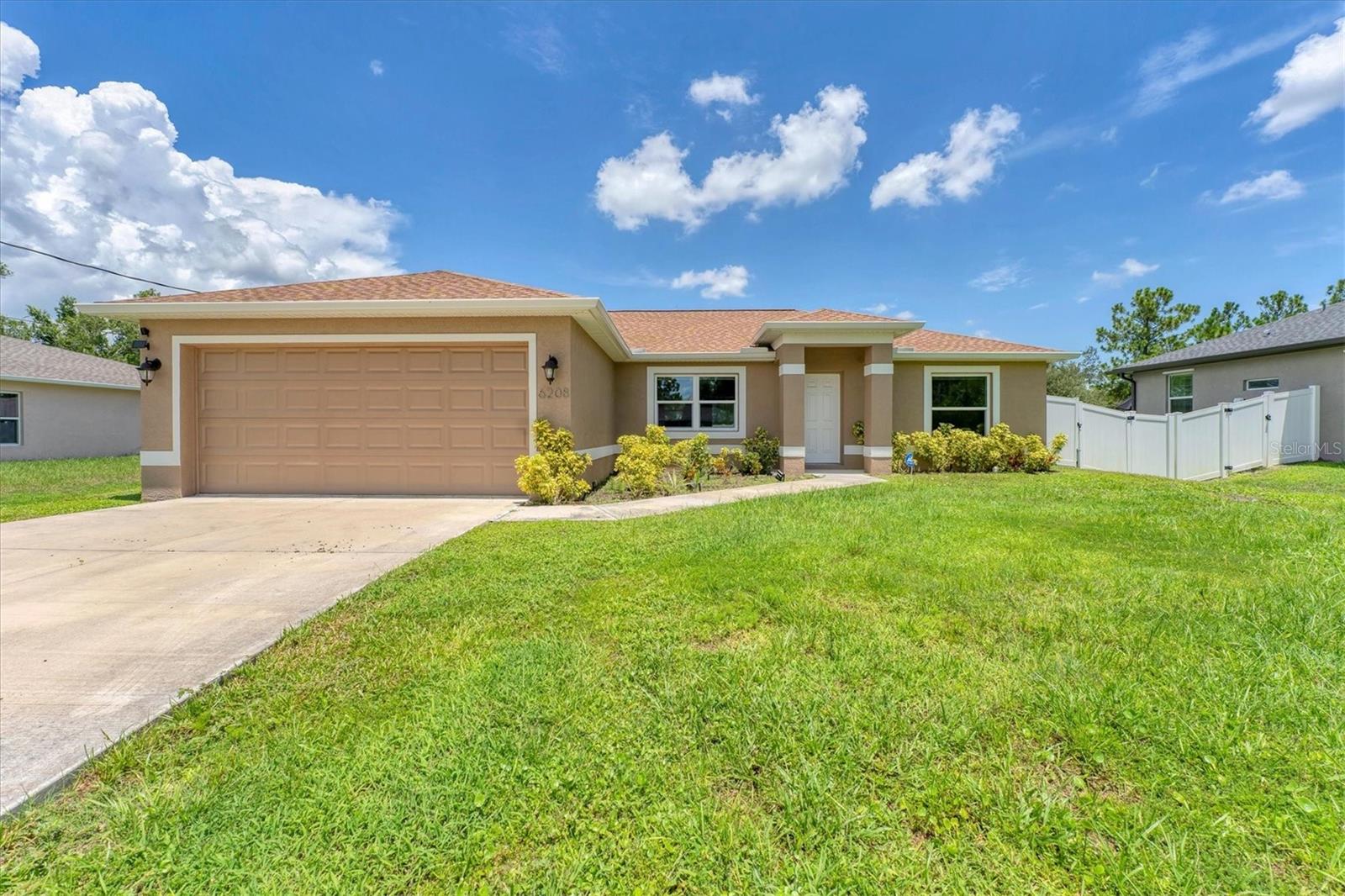 THIS PROPERTY QUALIFIES FOR A 1% LENDER INCENTIVE IF USING OUR PREFERRED LENDER!
Welcome to your dream home! This 2-year new (2023) ranch home is immaculate and combines modern upgrades with timeless style. The open-concept floor plan flows effortlessly, offering a spacious and inviting atmosphere. The smartly designed split layout ensures privacy, making it perfect for families, guests, or as a vacation or investment property.
As you step inside, you’ll immediately appreciate the beautiful ceramic tile flooring that flows seamlessly throughout the home. Vaulted ceilings create an open, airy feeling, while each window is framed with elegant granite sills. The living room is bright and welcoming, with a large window that invites natural light and a convenient coat closet.
The gourmet kitchen is a true highlight, featuring sleek granite countertops, a chic subway tile backsplash, and a large eat-at island with pendant lighting—perfect for casual dining or meal prep. Equipped with stainless steel appliances and a lazy Susan for extra storage, this kitchen is designed for both function and style. The dining area offers access through a large dual-opening slider to the screened lanai, providing a seamless indoor-outdoor living experience.
The spacious primary bedroom is a true retreat, with a walk-in closet and a luxurious ensuite bathroom that boasts a walk-in shower and dual sinks. The other two bedrooms, along with the main bathroom, are thoughtfully located on the opposite side of the home, offering privacy and comfort.
Built for peace of mind, this home features hurricane-impact windows, a durable hip roof with asphalt shingles, and central air conditioning to keep you comfortable year-round. The fully screened lanai is the perfect spot to unwind, overlooking the fully fenced backyard with a fire pit and a convenient three-zone sprinkler system for easy maintenance.
The laundry room is equipped with ample storage cupboards and a utility sink, while the two-car garage offers plenty of space and includes pull-down stairs to the attic for additional storage.
Located just minutes from I-75 and Highway 41, you’ll enjoy quick access to shopping, dining, golf courses, baseball spring training facilities, world-class fishing, boating, and the pristine Gulf Coast beaches. This home offers the perfect blend of luxury, convenience, and style.
Don’t miss your chance to own this beautiful home priced competitively over new builds in the area with many more upgrades such as, fully fenced yard, upgraded lighting, window treatments and washer/dryer included! Use the 1% incentive to buydown your interest rate down 1% or towards closing costs. Schedule your private showing today!