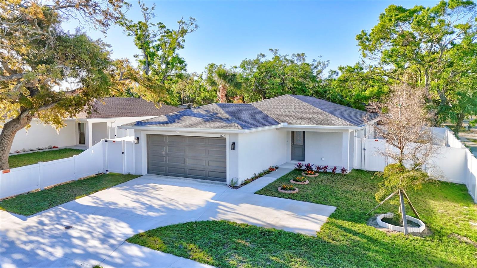 Amazing New Construction property/s in Sarasota’s thriving historic Central Cocoanut neighborhood! This brand-new home offers the perfect fusion of modern design, comfort, and convenience, just 3-4 minutes from downtown Sarasota and the city’s top attractions. Step inside the spacious 1,380 sq. ft. of beautifully designed living space, featuring high ceilings, canned lighting, three large bedrooms and two stylish bathrooms. High ceilings and luxury vinyl plank flooring create an open, airy ambiance, while large high impact hurricane grade windows all around, invites in loads of natural light while at the same time keeping the interior whisper quiet. The property itself is also a full 22 ft above sea level, bringing even more peach of mind. The thoughtfully designed open floor plan is ideal for both entertaining and everyday living. The spacious two car garage ensures that both of your vehicles are pampered, plus there is space in the driveway if another vehicle needs to be parked. The heart of the home is the gourmet kitchen, where high end stainless steel appliances, solid wood soft close cabinetry, quartz countertops, and a charming breakfast bar come together with both style and functionality. Each bedroom provides a private retreat, and the spa-inspired bathrooms boast elegant tiled showers and brushed aluminum finishes. You and your best pets will fully enjoy your covered back lanai and fenced yard, a perfect spot for relaxation, entertaining and allowing your best friend to run and enjoy. This home is built with extreme quality in mind and includes energy-efficient appliances and enhanced attic ventilation for year-round comfort. A Trane AC keeps the interior very comfortable, while a Trane water heater takes care of the water. Add to that, with no HOA, CDD fees, nor deed restrictions you have the freedom to fully enjoy your property. Access to the attic from the garage allows for additional storage space, as to the massive closets in each of the bedrooms. Located just minutes from St. Armands Circle, Sarasota Military Academy, Van Wezel Performing Arts Hall, Ringling College of Art and Design, Bayfront Park, and Sarasota’s world-famous beaches, this home is an incredible opportunity to own a brand-new residence in the rapidly growing Historical Central Cocoanut community. Seeing that its an easy car, bike or scooter ride downtown, or the quickly approaching Bay Project, you are guaranteed not to miss any of the activities downtown Sarasota provides, and never have to worry about downtown parking.