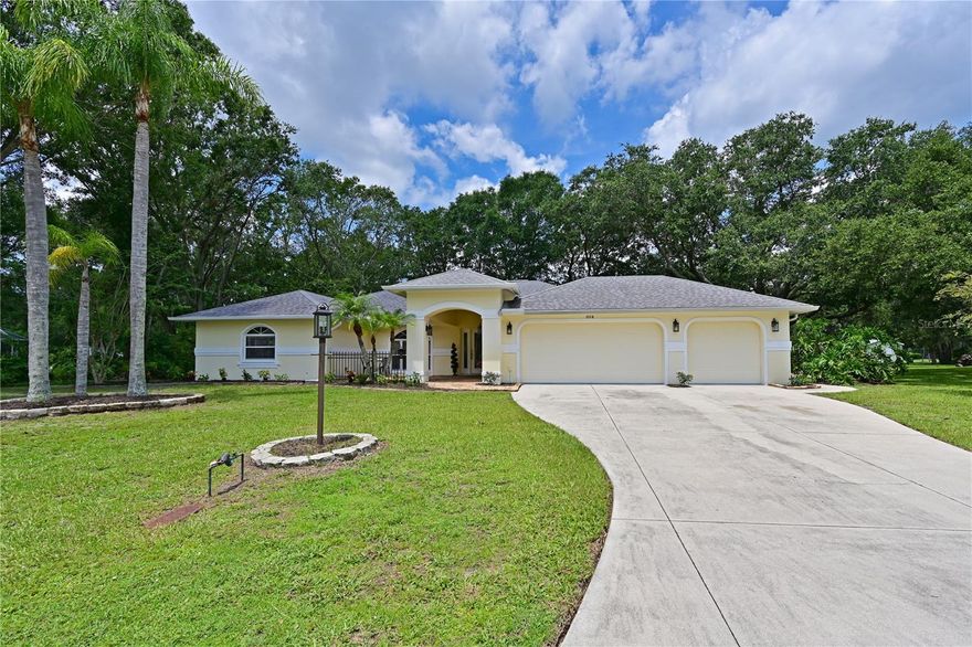 $20,000 PRICE REDUCTION - now reduced $40,000.....this is your home! Hidden Oaks - a small gem of a neighborhood with over sized lots and unique homes!  This is a sweet three bedroom, two bath home - great room plan with separate dining area and nice sized kitchen including plenty of storage and raised bar area.  There is a sparkling pool with lanai area,  all overlooking peaceful woods. With split bedrooms, everyone has privacy and the master bedroom is spacious with an oversized walk in closet.  The shared bath on the opposite side of the home also is used as the pool bath, so no wet floors. The three car garage is a rariety and so helpful - a perfect Florida "basement".  Engineered wood or tile throughout the home for easy maintenance. The home sits on a quiet, wooded lot that is just over 1/2 acre.  Nearby amenities (grocery, restaurants, shops, etc) and easy access to I75.  Home warranty included.  NEW ROOF 2023. Seller says ‘bring all offers’!