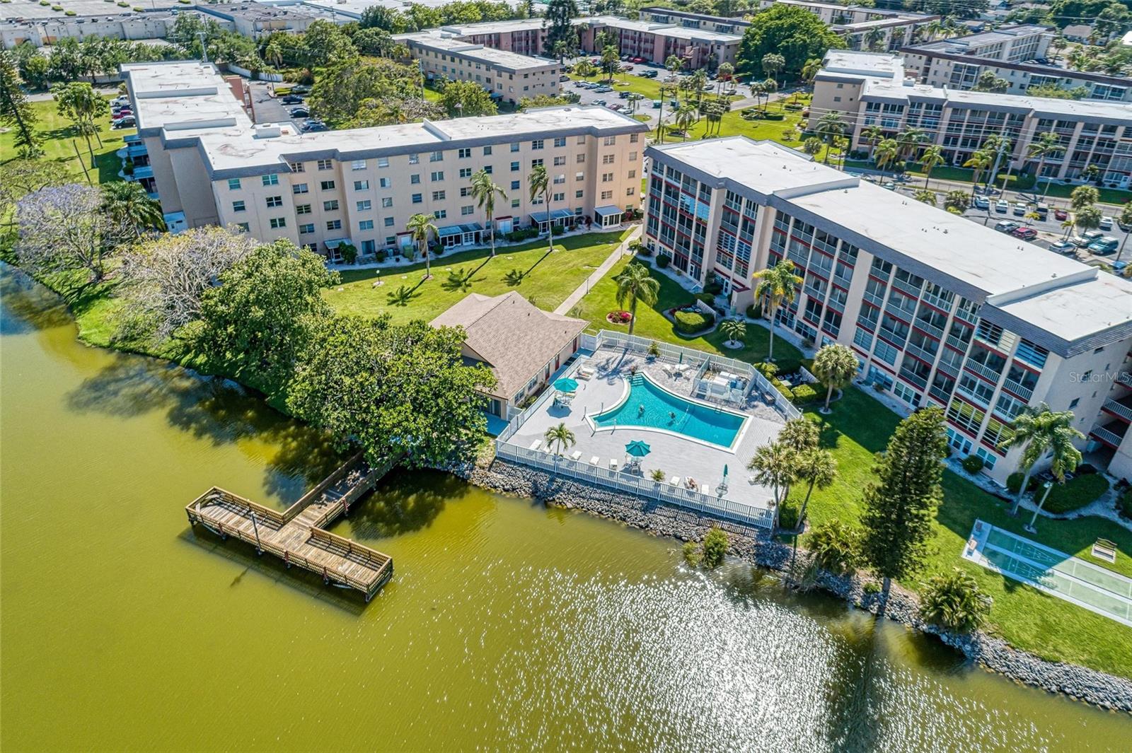 Step into this charming condo, beautifully designed with a Florida-inspired decor that exudes warmth and comfort. This turn-key unit is ready for you to settle in and start enjoying the relaxed lifestyle that Lake Bayshore has to offer.
As you enter, you’ll be greeted by a bright and inviting white kitchen, perfect for culinary creations and gatherings with friends. The open-concept layout seamlessly connects the living and dining areas, making it ideal for entertaining guests or simply enjoying a cozy movie night at home.
This condo features two spacious bedrooms and two updated bathrooms, providing ample space for you and your guests. Step out onto your serene lanai, where you can sip your morning coffee or unwind with a glass of wine while listening to the soothing sounds of nature.
Convenience is key with washer and dryer hookups available on the lanai, making laundry day a breeze. With a new AC unit (2022) and a newer hot water heater, you can enjoy comfort and efficiency year-round.
The community enhances your lifestyle with a sparkling pool and a welcoming clubhouse, perfect for socializing and meeting neighbors. Plus, your HOA includes internet and cable, allowing you to stay connected without the hassle.
All you need to do is bring your suitcase and move in—this adorable condo is ready to be your new home!