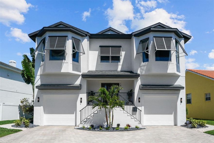 Discover waterfront luxury living in this prestigious contemporary home. This stunning property features four bedrooms and four and a half bathrooms with a host of upscale amenities. The custom designer kitchen showcases solid wood cabinetry, granite countertops, and stainless steel appliances, ideal for culinary enthusiasts. Entertain effortlessly with the open floorplan flowing into a formal dining and living area, offering panoramic views of the waterfront paradise outside. Retreat to the owner suite overlooking the serene water views with its own en suite bathroom and walk in closet. Additional bedrooms also feature en suite bathrooms, ensuring comfort and privacy for all.  This meticulously updated home offers modern conveniences and luxurious touches throughout, including fully redesigned bathrooms and brand new appliances. Indulge in leisure activities in the media room with its large projector screen. Outside, the expansive swimming pool offers a private oasis with breathtaking water vistas, making it the ultimate spot for relaxation and entertainment. Boating enthusiasts will appreciate the deep water access with no bridges to Bayou Grande, located on the Southside of Weedon Island Preserve area and the Intracoastal Waterway. The oversized garage, equipped with a car lift, provides ample space for up to four cars and additional storage.
Enjoy the convenience of nearby amenities, including schools, the Islander Market, the new Whole Food, nearby parks and more!  Experience the epitome of luxury living in this exquisite waterfront retreat just a short drive to downtown St. Pete, the Beaches and Tampa.  Schedule your private tour today.