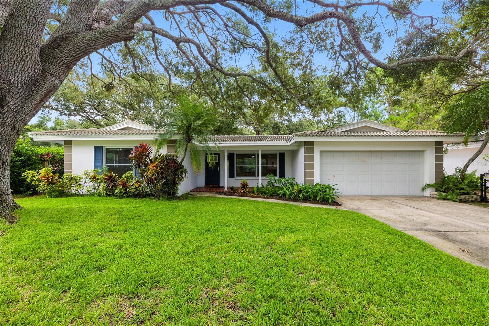 Welcome to your dream oasis at 1861 Harmony Drive in sunny Clearwater, FL! This delightful 2-bedroom, 2-bathroom home offers 1,273 square feet of cozy living space on a generous 9,000 square foot lot. With a roomy attached two-car garage, you’ll have ample space for parking and storage.
Inside, you'll find beautiful real oak hardwood floors and the comfort of central heating and electric air conditioning—featuring a new unit from 2023. The kitchen is both stylish and practical, featuring quartz countertops. Enjoy peace of mind with impact windows and doors, a sturdy concrete tile roof from 2015, and energy-efficient solar panels.
Relax in your private outdoor space, perfect for hosting gatherings or enjoying quiet time. The porch offers a serene spot to unwind, with tranquil sounds from your outdoor koi pond and backing up to the sprawling 170-acre Eagle Lake Park. Conveniently located, you’ll have quick access to Clearwater Beach, downtown Dunedin, St. Pete, Tampa Airport, and several scenic biking trails. All of this in a no-flood zone! Don’t miss out on this paradise!