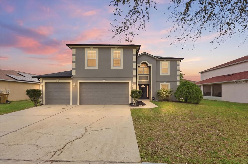 Photo of 627 Woodland Creek Boulevard, Kissimmee, FL 34744 (MLS # O6392189)