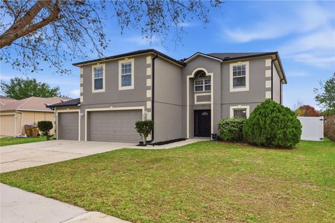 Photo of 627 Woodland Creek Boulevard, Kissimmee, FL 34744 (MLS # O6392189)