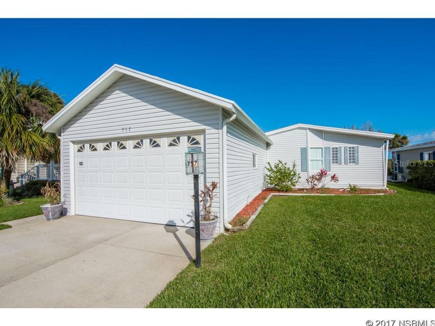 Welcome to Edgewater Landing - a fabulous gated adult community offering the best of an active Florida Vacation Lifestyle! This lovely, spacious 2 bedroom, 2 bath manufactured home is on the Intracoastal Waterway with a view you will love. Imagine watching the boats go by as you enjoy your morning coffee! This home has it all, beautiful sun room, living room, dining room, family room / kitchen combo, tile in main rooms, covered porch, 2-car garage, plenty of cabinetry and closet space, plus a utility room.  No expensive lot fees here as you own the land your home sits on!   Desirable Edgewater Landing is complete with wonderful amenities, such as a Clubhouse for social activities, pool, tennis, fishing, boating and more. It is time to Own a Piece of Paradise! Call today for your private showing of this move in ready home. This one will not last! ;Water: City