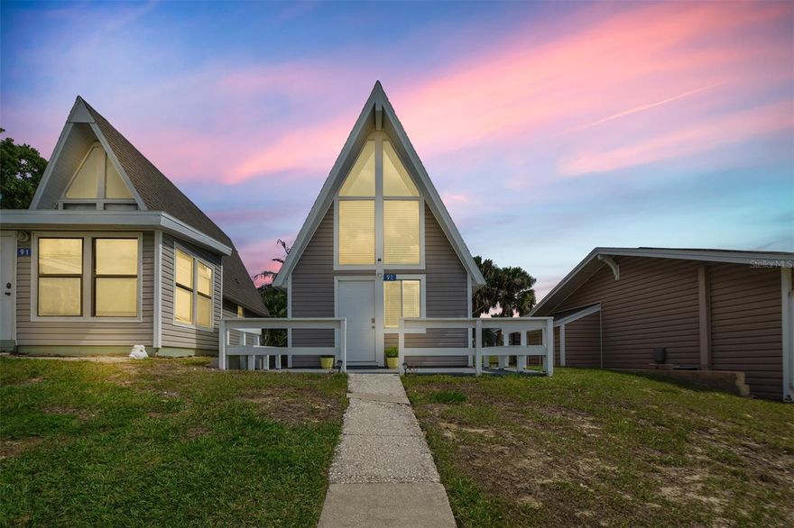 Completely remodeled and turnkey, this 2-bedroom, 1-bath A-frame condo in gated Vacation Village offers standout appeal as a personal getaway, seasonal retreat, or Airbnb-style investment opportunity, subject to HOA and local regulations. Being sold fully furnished, all furniture is included, making this an easy plug-and-play option for immediate personal use or short-term rental setup. The interior has been thoughtfully updated with new appliances, an on-demand water heater, new roof, renovated kitchen and bath, upgraded finishes, and a bright open living space with soaring ceilings, dramatic windows, and a spiral staircase leading to the loft-style second bedroom. The main-level bedroom adds flexibility for guests, while the private patio and charming front porch create inviting outdoor spaces to relax after a day of exploring Central Florida. Be sure to CLICK THE VIRTUAL TOUR FOR 24/7 SHOWINGS experience right from your phone, tablet, or computer.??
Located in a gated community with access to Lake Louisa, plus community amenities including a pool, tennis courts, recreation center, playground, fishing, and a private boat ramp, this property is well-positioned for vacation use and guest appeal. Just minutes from Lake Louisa State Park, shopping and dining along US-27 and SR-50, Historic Downtown Clermont, and Clermont Waterfront Park on Lake Minneola, the location blends outdoor recreation with everyday convenience. It is also near the Olympus development and within easy reach of Disney, Margaritaville, and Orlando-area attractions, making it an attractive option for buyers seeking a low-maintenance property in a high-demand tourism corridor. Whether you are looking for a weekend escape, income-producing property, or updated Florida retreat, this one checks the boxes.
