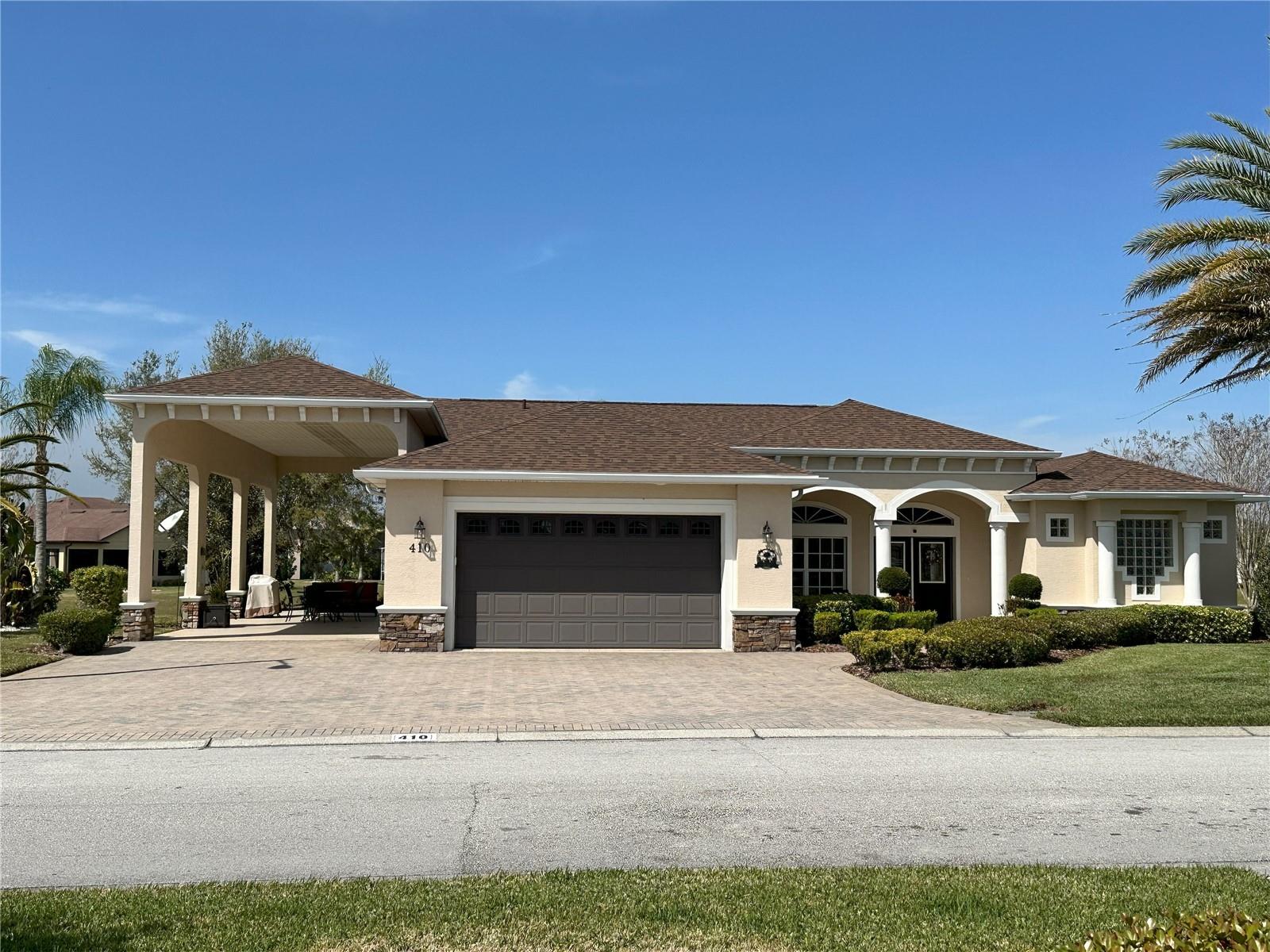 This beautiful home is a must see! Located in the sought after community of Mt. Olive Shores North, a 55+ deed restricted community. This 4 bed/3 bath is very spacious at just over 2200 square feet. The main entry to the home leads to a large open kitchen and eating area with granite counter tops. The lanai was enclosed for added living space. This home has four bedrooms and three baths which make it the perfect home for family and friends to enjoy the beautiful Florida weather. The RV port is approximately 16' x 55" and has a two car garage. The roof was just replaced in 2024 and it has a transferable warranty. The A/C unit was replaced in 2021 and new irrigation and sod was laid in 2023. This home comes partially furnished including the kitchen table and chairs plus barstools. Outdoor front porch table and chairs and front room furniture. Located on a corner directly across from the clubhouse with an open area view from the back of the house. Call for an appointment today to see this wonderful home.