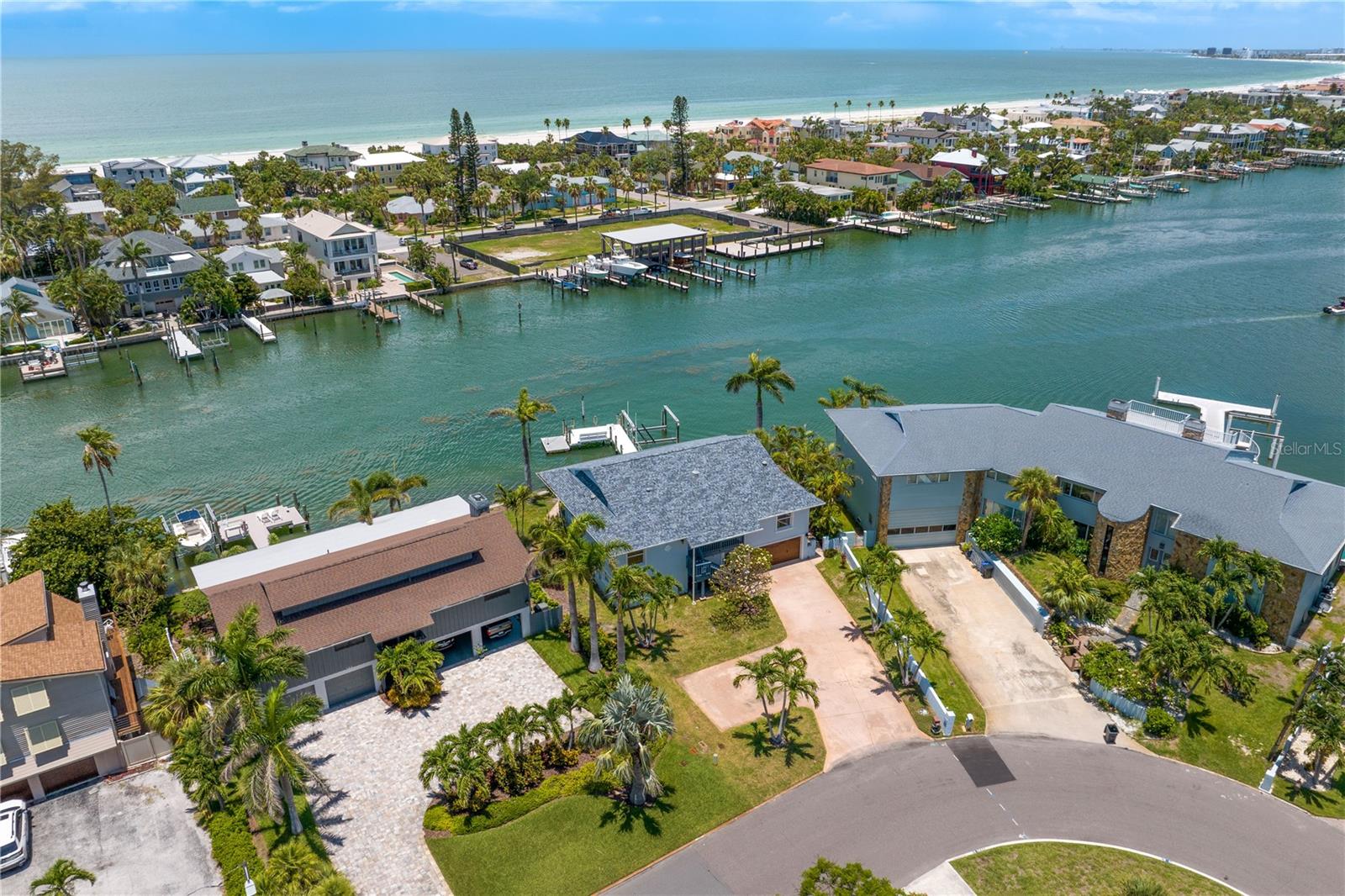 Location, Location, Elevation! Live the ultimate waterfront lifestyle with 108 feet of protected deep-water frontage on the Pass-A-Grille Back Channel—ideal for the boating and fishing enthusiast. Enjoy stunning waterfront views, the iconic Don CeSar Hotel and award-winning sunsets everyday!
This FEMA-compliant concrete block home offers over 4,000 sq ft under roof, including 400+ sq ft of covered balcony accessible from the living, dining, and primary bedroom. A 16,000 lb boat lift, newer seawall, tropical landscape and the 35-foot pool elevate your outdoor experience. With a spacious 3-car garage, 1,000 sq ft of bonus space, and ample on-site parking, there’s room for all your toys—boats, cars, and even a motorhome. Recent upgrades include a 2024 roof, 2023 HVAC, impact-rated windows and sliding glass doors, and fresh exterior paint in 2025.
Vina Del Mar Island has a wonderful Park with a covered pavilion, tennis, pickleball and basketball courts, playground, adult exercise stations and a Dog Park!!! Vina Del Mar Island was built higher than any other waterfront community along the barrier islands, it affords no bridges and just minutes to the Gulf and the only access is through Historic Pass A Grille. Have fun walking to the charming shops, Old Florida style restaurants and the white sandy beaches. This is a golf cart friendly community with themed golf cart parades throughout the year and a beach bonfire and lighted boat parade during the holidays. Easy 15 min to downtown St Petersburg to see world renowned museums and trendy restaurants. 30 mins to Tampa Intl Airport make business or casual travel a breeze!