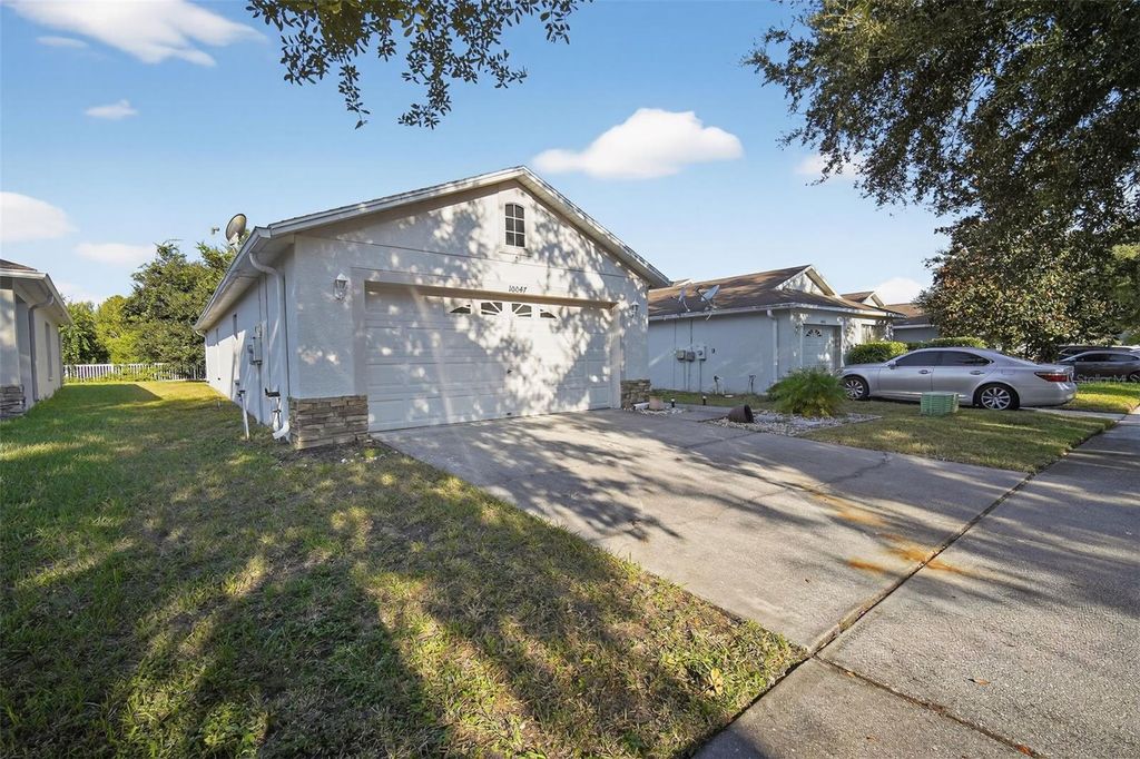 Photo of 10047 Landport Way, Land O Lakes, FL 34638 (MLS # TB8425231)