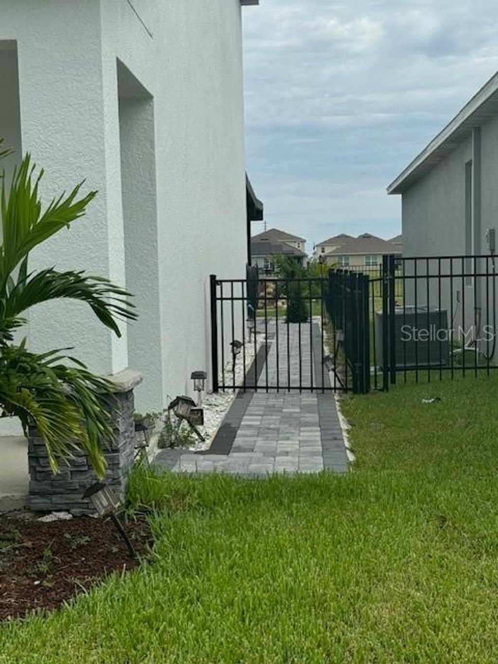 Photo of 313 Talisi Loop, Saint Cloud, FL 34771 (MLS # O6370180)