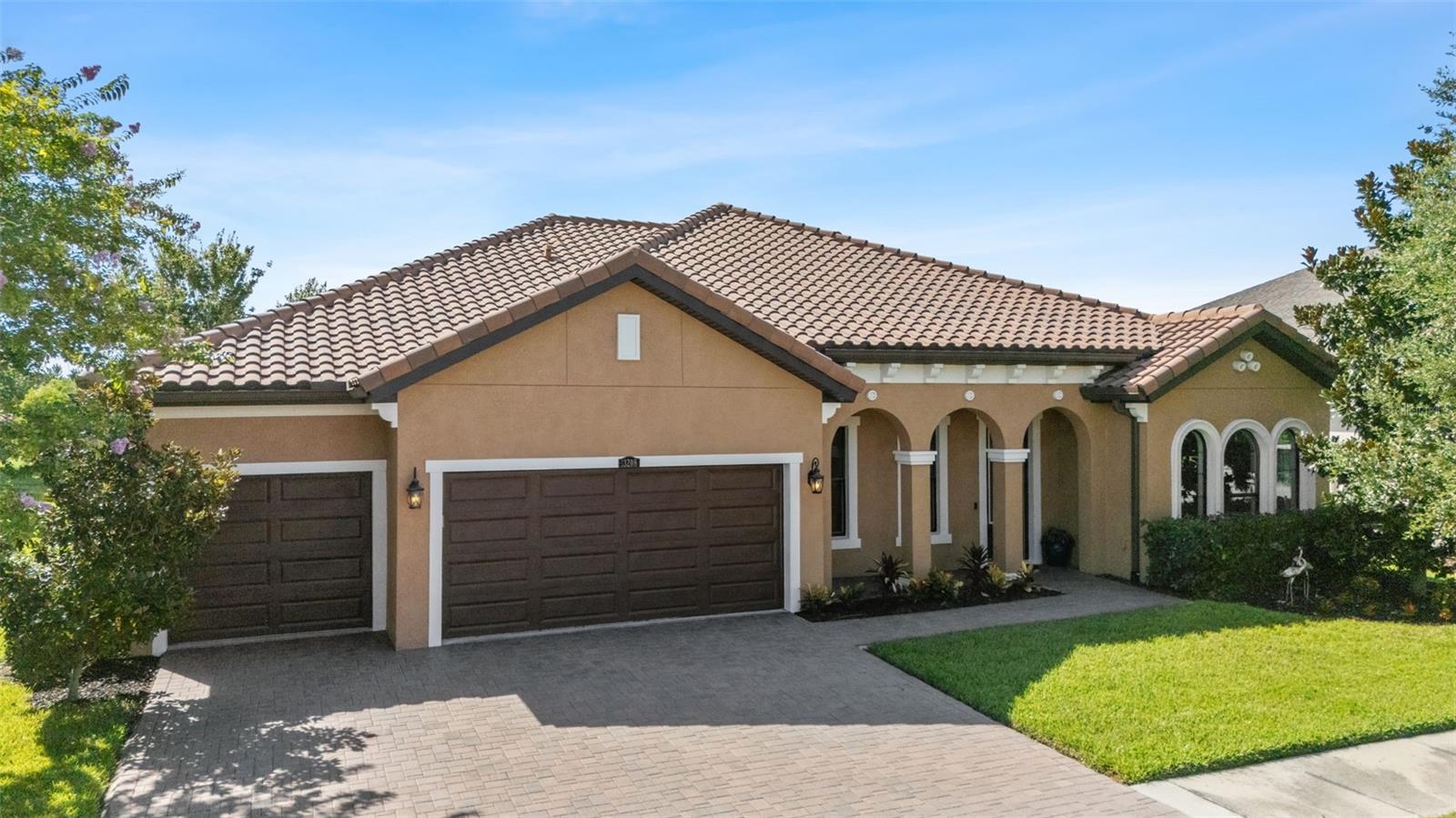 It just feels like HOME! What could be more desirable than residing on a picturesque pond within a secure, gated community? The answer lies in this stunning residence, nestled between two highly sought-after ponds, one of which features a beautifully lighted fountain. This property boasts the popular West Bay Key Largo floor plan, renowned for its exceptional design. This luxurious West Bay Pool/Spa home, complete with premium upgrades throughout, is situated on a breathtaking waterfront lot within the prestigious WATERLEAF community. This highly sought-after, single-story residence features 3,192 square feet of opulent living space, complete with a fantastic open floor plan, soaring ceilings, four bedrooms, three bathrooms, an office, bonus room, and an expansive three-car garage. Once again, It just feels like HOME! A beautifully brick-paved driveway and walkway lead to the grand entrance and front porch area. Upon entering the home, you are greeted by an open, grand foyer and a formal dining room that is large enough for the grandest of festivals. The private office space boasts gorgeous arch windows, high ceilings, and can easily be converted into a fifth bedroom. The spacious, open kitchen features 42-inch stacked cabinets, crown molding, upgraded stainless steel gourmet appliances, a custom canopy hood, a large center island, quartz countertops, a clean-looking subway backsplash, a custom pantry with built-ins, and upgraded, dimmable lighting. The beautiful Owner's Retreat is GRAND in every way, wait till you see the walk-in closet with highly optioned built-ins. The Owner's bath boasts quartz double sinks with a vanity area, a six-foot garden tub, a large walk-in, frameless shower, upgraded tile, and an incredibly spacious shower with upgraded hardware. The optional spot-free water faucets will stay spotless, especially with a professionally installed water softener. The spacious Great Room is perfect for entertaining, with quadruple pocket sliders that open to a huge, private, extended screened lanai. Enjoy this oasis from sunrise to sunset by the oversized, gorgeous custom saltwater pool/spa area, which looks out upon beautiful landscaping and a water conservation area. The large, highly optioned pool screen even has the upgraded no-see-um screens for your comfort and protection. Speaking of protection, your home is protected with a gutter system that was also installed. The backyard offers ample space to relax and unwind. This home has a unique peninsula of land between the two ponds, perfect for hosting temporary gatherings. The home is wired for a security system that can be expanded to meet additional needs and is prewired for a speaker sound system. This property is an absolute must-see! WATERLEAF is a highly desirable, gated community that offers a Clubhouse with a beautiful pool area, tiki huts, stunning palms, and landscaping, as well as a resort-style pool. Residents can enjoy exercise stations along the walking trail, a basketball court, park, playground, and two dog parks. The HOA fee includes ULTRAFI high-speed Internet and cable. The community is conveniently located near I-75, HWY 301, Tampa International Airport, downtown Tampa, hospitals, shopping centers, schools, golf courses, and a wide range.
