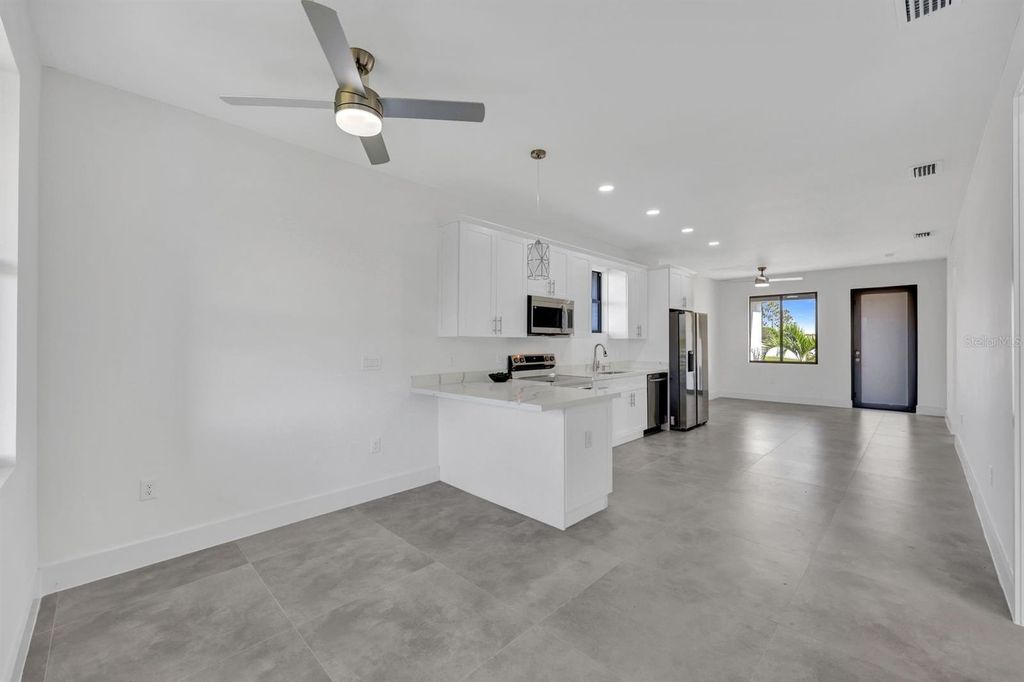 Photo of 312 Progress Avenue, Lehigh Acres, FL 33974 (MLS # TB8436549)