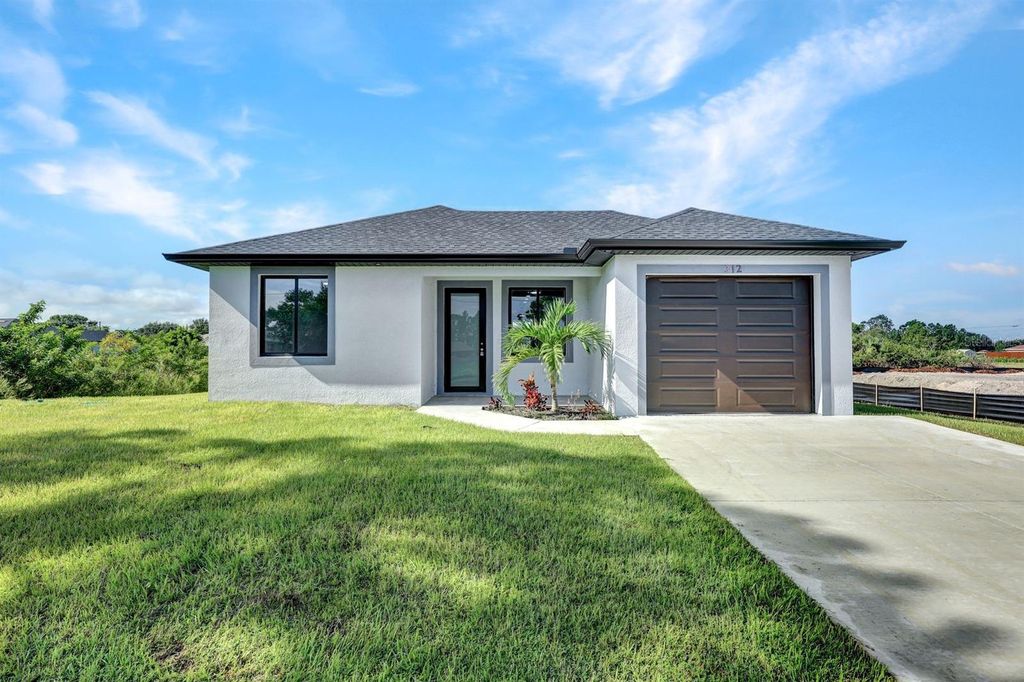 Photo of 312 Progress Avenue, Lehigh Acres, FL 33974 (MLS # TB8436549)