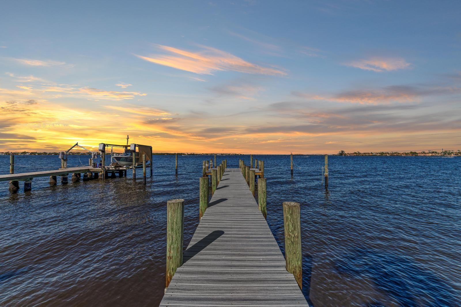 EXPERIENCE LUXURY WATERFRONT LIVING FOR LESS - NEWLY RENOVATED
This exceptional Riverside Drive East home on the majestic Manatee River presents an unparalleled waterfront lifestyle with sweeping, unobstructed views of the river’s widest expanse. Full riparian rights and a newly rebuilt dock invites you to indulge in the serenity of waterfront living—whether it's watching dolphins play in the shimmering water, enjoying the gentle river breezes, or savoring breathtaking sunrises and sunsets from your private oasis.
Originally built in 1949, this meticulously renovated 3-bedroom, 2-bath block-and-stucco home harmonizes timeless charm with modern elegance. The refinished original hardwood floors exude warmth and character, while the living room’s floor-to-ceiling bookshelves add a sophisticated touch. The vaulted master bedroom ceiling, complemented by a picturesque bay window and cozy window seat, frames the spectacular river views, creating a tranquil retreat within your own home. Nearly every room is designed to capture the beauty of the waterfront, ensuring an immersive experience of luxury and relaxation.
Recent upgrades enhance both aesthetics and functionality, including a remodeled kitchen and bathrooms, new stainless steel appliances, energy-efficient double-pane windows, and a durable metal roof installed in 2011. Additional updates include a water heater replaced in 2022 and an AC system installed in 2014. The full stand-up attic with hardwood flooring provides ample storage, while the oversized 1.5-car garage adds even more space for your belongings. For those with a passion for adventure, the property includes RV parking with a dedicated 30 AMP service.
Nestled on an oversized lot with room for a pool. There are 75 feet of pristine river frontage, city-maintained seawall ensuring peace of mind as you relish the effortless waterfront lifestyle. Situated in a tranquil yet highly accessible location, you’ll enjoy seamless access to US-41, 301, and I-75, as well as world-renowned beaches, the vibrant shopping and dining at University Town Center Mall, and the historic charm of downtown Bradenton. For a truly special experience, take your boat out for an unforgettable cruise to nearby riverfront restaurants, making every outing a scenic adventure.
This rare gem offers an extraordinary opportunity to own a luxurious waterfront home at an incredible value. Whether you seek a serene personal retreat or an investment property with no HOA rental restrictions, this is your chance to make your waterfront dreams a reality!