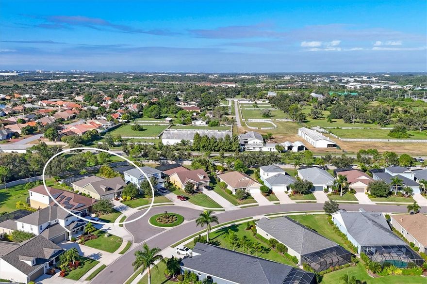 One or more photo(s) has been virtually staged. Welcome to this beautifully maintained 2016-built home in the gated community of Magnolia Point. Offering 3 bedrooms, 3 bathrooms, and 2,069 square feet, this move-in ready residence sits on a very private, manicured lot with thoughtful updates throughout. The open-concept floor plan features spacious living and dining areas, a well-appointed kitchen, and seamless indoor-outdoor flow to the screened lanai. Enjoy a heated pool with handicap accessibility features, ideal for year-round use. Recent improvements include a new roof (2023), pool and cage (2022), and exterior paint (2023), providing peace of mind for the next owner. Outdoor features include a large fenced dog run and access to community walking trails, offering both privacy and outdoor enjoyment. Conveniently located near shopping and dining, this home is approximately 5 miles to the Ringling Museum,  5 miles to SRQ Airport, 9 miles to Lido Beach, and just 8 miles to IMG Academy.