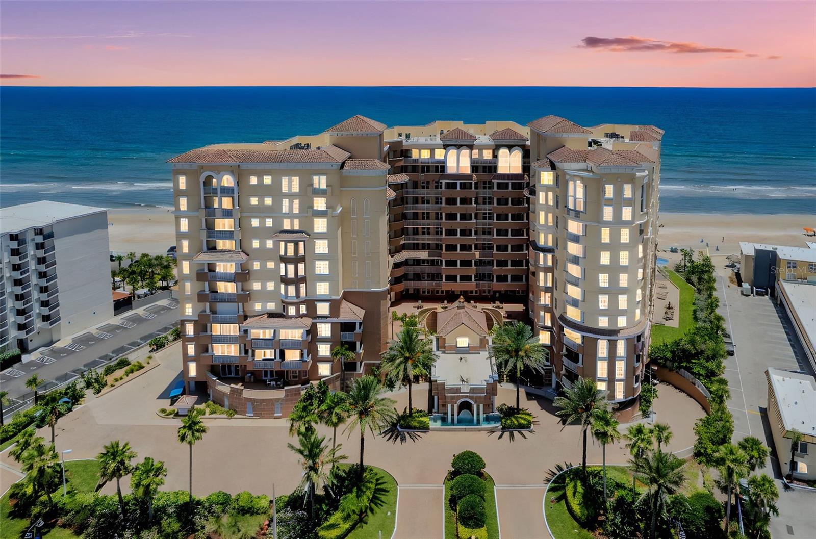 Direct oceanfront living awaits in this rare 3-bed, 3-bath luxury condo in the sought-after 07-stack at Bella Vista, a premier residential building in Daytona Beach Shores. Enjoy sweeping Atlantic views, refined finishes, and private beach access. This stunning oceanfront unit offers over 2,300 square feet and showcases 270-degree Atlantic views from an expansive private 38' x 16' balcony, a refined outdoor extension of your living space for relaxation, entertaining, or simply enjoying the sea breeze. Thoughtfully designed, this elegant condo features two primary en-suites, each with private balcony access and breathtaking views, offering the perfect blend of relaxation and comfort. An additional bedroom and bath provide flexible space for guests or a home office.The open-concept layout includes a great room and dining area with a custom electric fireplace. The gourmet kitchen offers elegant 42'' rich wood cabinetry with crown molding inlay and stainless steel appliances, including a built-in wall oven and microwave. Dine effortlessly at the pendant-lit breakfast bar or in the elegant dining area designed for refined coastal living. Step into the owner's suite, featuring his-and-hers closets and sleek vanities with built-in storage. The spa-inspired bath offers a large walk-in shower and jetted tub, plus direct access to a private oceanfront balcony for serene coastal views. Bella Vista presents a premier collection of resort-style amenities, including one of the largest heated oceanfront pools in the area, a relaxing spa, fully equipped fitness center, billiards room, and an elegant oceanfront club room. Residents enjoy private beach access, secure entry with on-site management, oceanfront fire pits with built-in seating, and the convenience of underground parking and private storage for beach essentials. Don't let this world-class, resort-style living opportunity slip away, offering an unparalleled experience in luxury! One or more photos have been virtually staged. All sizes are approximate. All information deemed accurate but cannot be guaranteed. Call for your private showing today!