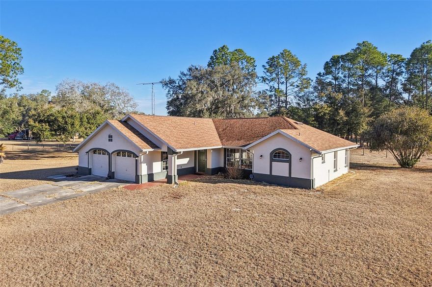 Looking for a little land without being far from town? This 3 bedroom, 2 bathroom, concrete block home  sits on 5.04 fenced acres just outside Bushnell on a paved county road. The home offers a split floor plan, Florida room, inside laundry, and a 2-car garage with additional storage space for the things that come with country living. The setting is the star here…Open, usable acreage with room for animals, gardening, or simply enjoying privacy and space, and no HOA.  Want to build a shooting berm? No problem. Want to raise baby goats?  Sure thing. Your land, your rules. Pictures were taken just after our awful freeze but take our word for it…this is normally green pastures all the way. 
The home originally built in 1997 has been well-loved but is definitely ready for your updates. Maybe nee kitchen counter tops. Maybe you refinish the cabinets and install new hardware. Bring your vision!  Great land, great location, and room to make it your own over time.  This home is easy to show, but by appointment only. Please do not go on-site without your Realtor. This home qualifies for all financing types, bring your offer and let’s make a deal.