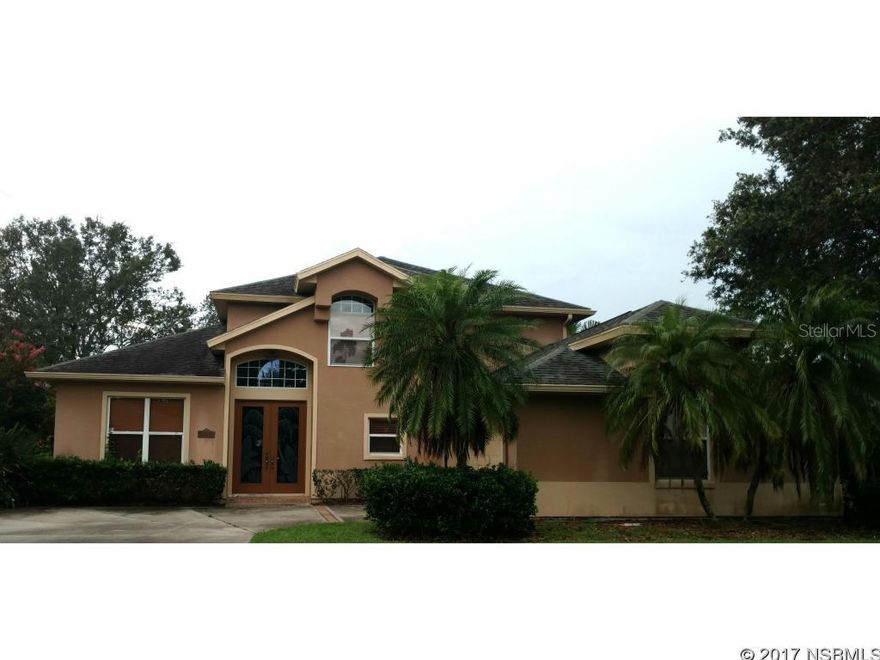 Come home to interior design upgrades throughout this ICI custom built 3 bedroom/2.5 bath pool/spa tropical oasis!  With volume ceilings and open floor plan, this home is perfect for family time and entertaining!  The grand wood burning fireplace draws you in with its mantle and hearth boasting a floor to ceiling mirrored design.  Warm earth tones, solid wood cabinetry, large breakfast bar that comfortable seats 6 and subzero refrigerator make the gourmet kitchen feel like home.  The master retreat is downstairs with its own private access to the tropical resort like heated pool with relaxing spa and large patio area.  It also has a spacious en-suite bath with large walk in shower and soaking tub as well as an oversized walk-in closet.  Upstairs there are two bedrooms and another full bath in addition to a large loft area that could easily be converted and used as a 4th bedroom.  This gated community has a park like setting and it's residents enjoy the Port Orange lifestyle including schools, shopping, restaurants and community events all while being close to the beach! ;Water: City