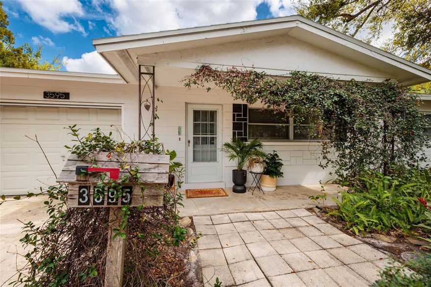 Nestled in a quiet neighborhood in the heart of Tyrone area just minutes to the beaches, downtown St.Pete, restaurants and shopping, this absolutely charming home is cute as a button! Block construction located in a NO FLOOD ZONE, a high and dry area of St.Petersburg.Many updates to enjoy when you enter this 2 bedroom 2 bath home with a huge sunroom adding extra living space to this home. The living room  flows into the open kitchen layout.  The updated kitchen offers an island for extra cooking space and dining, solid stone counters and wood cabinets. Luxury vinyl flooring throughout. The garage features the second bathroom along with laundry area. The home sits on a corner lot that offers a huge fenced yard with lots of room to add a pool or build onto the home. This is THE perfect home for a first time homebuyer, adding to your rental portfolio or a seasonal home to enjoy! This one checks all the boxes and is the one you have been waiting for! Call today to see this St.Pete gem before it is gone!