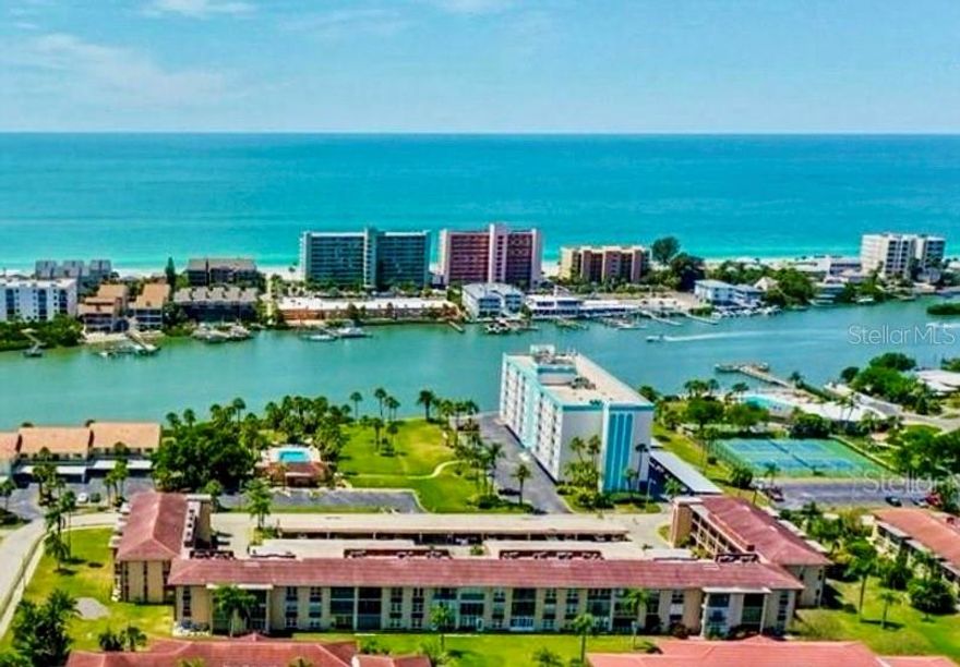 Welcome to waterfront living in the highly sought-after community of Imperial Point! This beautifully maintained corner-unit condo offers two spacious bedrooms and two updated bathrooms, combining comfort, style, and over $60,000 in thoughtful upgrades.

The heart of the home is the stunning, modern kitchen featuring natural hardwood cabinetry, sleek granite countertops, stainless steel appliances, and an induction range. This kitchen is perfect for home chefs who value both style and precision. Both bathrooms have been fully remodeled within the past two years, showcasing fresh, timeless finishes that add a touch of luxury to everyday living.

Peace of mind comes with more than $30,000 invested in brand-new hurricane windows and hurricane-rated doors, improving both safety and energy efficiency. Natural light pours through the home, creating a bright and welcoming atmosphere throughout the 1,293 heated square feet of living space.

This condo is being sold fully furnished with high-quality furnishings, making your move completely effortless. Additional upgrades include new panel doors and trim, an indoor washer and dryer, hookups for a water softener, a REME-HALO air purification system, and an Aprilaire dehumidifier connected to the air handler to maintain exceptional indoor air quality.

Step outside to enjoy your private patio, plus the convenience of one covered parking space and generous storage.

Living in Imperial Point means embracing an incredible waterfront lifestyle. Residents enjoy direct access to a private fishing dock and boat launch—perfect for boaters, anglers, and sunset lovers alike. The community is packed with amenities including two swimming pools (one heated), a 24-hour fitness center, tennis and pickleball courts, shuffleboard, bocce ball, volleyball, and two clubhouses hosting social events, yoga classes, game nights, and holiday gatherings.

Your monthly HOA fee simplifies life by covering internet, cable, water, and access to all community amenities. With only one entrance and exit, Imperial Point offers a peaceful, friendly neighborhood atmosphere with a mix of condos, villas, and single-family homes.

Whether you’re looking for an active lifestyle or a relaxing coastal retreat, this move-in-ready home delivers the best of Florida living.

Don’t miss your chance to own in one of Pinellas County’s most desirable waterfront communities. Schedule your private showing today, your new lifestyle awaits.