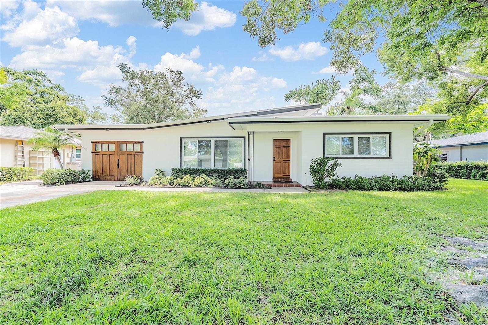 Experience refined Florida living in this exquisitely renovated retreat, ideally situated in the heart of Largo. This thoughtfully redesigned 3-bedroom, 2-bathroom residence seamlessly blends timeless sophistication with modern functionality.
Step through the front door into a sun-drenched, open-concept layout where natural light pours through hurricane impact-rated windows, highlighting elegant recessed lighting, 2” designer blinds, and luxury vinyl flooring throughout. Every detail has been curated for comfort and style.
At the heart of the home, the chef’s kitchen dazzles with shimmering white quartz countertops and matching backsplash, solid wood soft-close shaker cabinetry adorned with rich brushed gold hardware, and a complete suite of premium Frigidaire stainless steel appliances. The inviting breakfast bar offers the perfect setting for morning coffee or evening wine.
The expansive owner’s suite is a serene sanctuary, featuring plush new carpeting, a double-door closet, an independent mini-split system for personalized comfort, and a spa-inspired en suite bath with luxurious finishes.
Whether entertaining guests or unwinding with a book, the enclosed Florida room offers a versatile extension of living space with views of the beautifully landscaped backyard, fully fenced for privacy and ideal for outdoor lounging or grilling on the open patio.
A rare find, the oversized parking pad accommodates up to four additional vehicles beyond the attached one-car garage—perfect for guests or extra toys.
This home also offers extensive upgrades for peace of mind: new HVAC (2025), architectural shingle roof (2022), hurricane-rated custom carriage garage door, gutters with leaf guards (2020), modernized electrical and plumbing systems, termite tenting (2023), and a reclaimed water irrigation system for eco-conscious lawn care.
Tucked beneath a canopy of majestic oak trees in a quiet, established neighborhood, this location is walkable to McMullen Park, Largo Central Park, golf courses, the community center, local dining, and boutique shopping. Just 20 minutes to world-renowned Clearwater Beach and 15 minutes to St. Pete–Clearwater Airport.