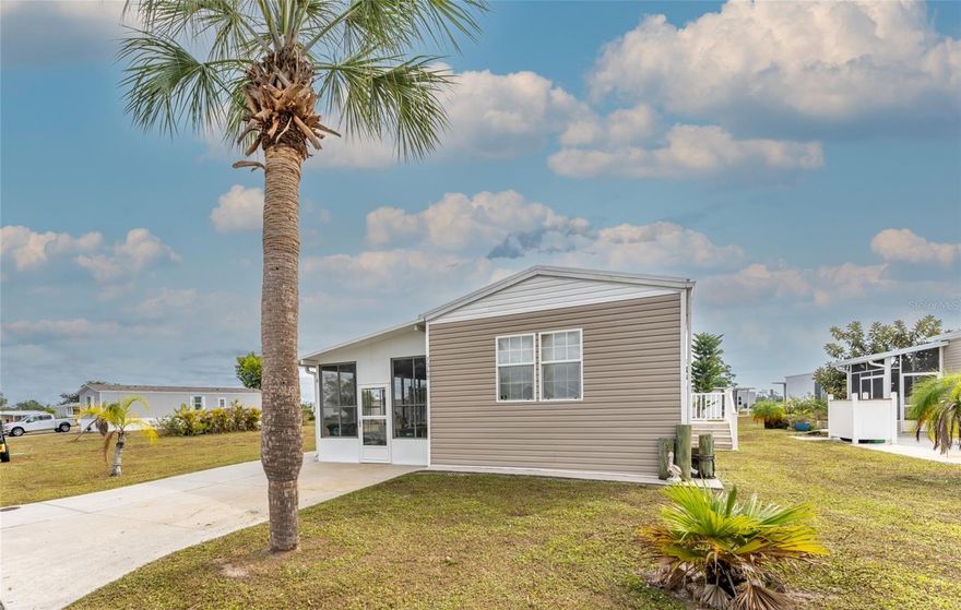 Don’t miss this incredible opportunity to sneak out of the cold winter months at an affordable price! This 2005 manufactured home has high ceilings and is 16 Feet wide! It is located in the desired WATERFRONT COMMUNITY Village of Holiday Lake. Here you will find a 2 bedroom/2 bath home with 2 LANAI areas, a workshop and separate shed and many UPDATES INCLUDING TIN ROOF and SIDING. The LANAI has a NEW ROOF, NEW DOORS and 8 NEW WINDOWS.  

This home is well appointed with an INSIDE LAUNDRY, CROWN MOLDING and an EAT IN KITCHEN offering an abundance of cabinets and counterspace. The master suite has oversized closets and ensuite bathroom and the spacious guest bedroom and bath are sure to please visiting friends and family. Step out to your extended lanai with your morning coffee or afternoon cocktail after a day or fishing or round of golf and enjoy your own private oasis.  Golf Cart is not included. Most furniture stays.
OWN YOUR OWN LAND, ALL AGES WELCOME

The Village of Holiday Lake boasts 25+ boat slips providing water access to the Gulf, beautiful pool area with 2 POOLS and BBQ area. There is always something going on at the large recreation hall with full kitchen, craft room, FITNESS CENTER, laundry facility along with areas for woodworking, tennis, PICKLEBALL+, shuffleboard and more. The outdoor enthusiast in you will love the closeness of boating and fishing from the community docks and boat ramp. Close proximity to the areas pristine Gulf of Mexico beaches, including under 15 minutes away from Boca Grande/Gasparilla Island. If you like golfing several of the areas finest golf course are within a few miles. The foodie in you will love the local delights like Jerry’s Tiki Hut, TT’s Tiki on the Water and the Sandbar Tiki & Grill all of which can be accessed by boat or by car.