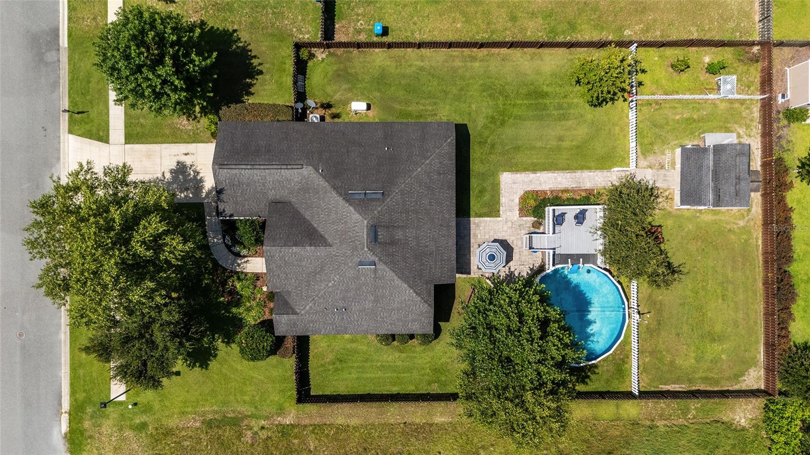 Dive into the ultimate blend of comfort, convenience, and outdoor fun with this move-in-ready POOL HOME packed with thoughtful updates! Inside, you’ll find an open floor plan with a kitchen that features granite countertops, plus generous-sized bedrooms and a versatile bonus room that works perfectly as an office or additional bedroom. The A/C has been professionally serviced every six months, with a full system flush completed in 2024. Out back, relax in the 18,000-gallon Kirsplash pool with a spacious deck—no water bills for refills since it pulls straight from the property’s well. The pool liner is just two years old, and the pump is 2.5 years old for low-maintenance living. The triple-fenced backyard offers flexible spaces for pets, gardening, or play, and you’ll enjoy picking fresh oranges, tangelos, tomatoes, and lemons right from your own yard. Additional highlights include a powered 12x8 storage shed, a 50 AMP RV hookup on the guest side of the house, and a water softener—bringing both practicality and fun to everyday life.